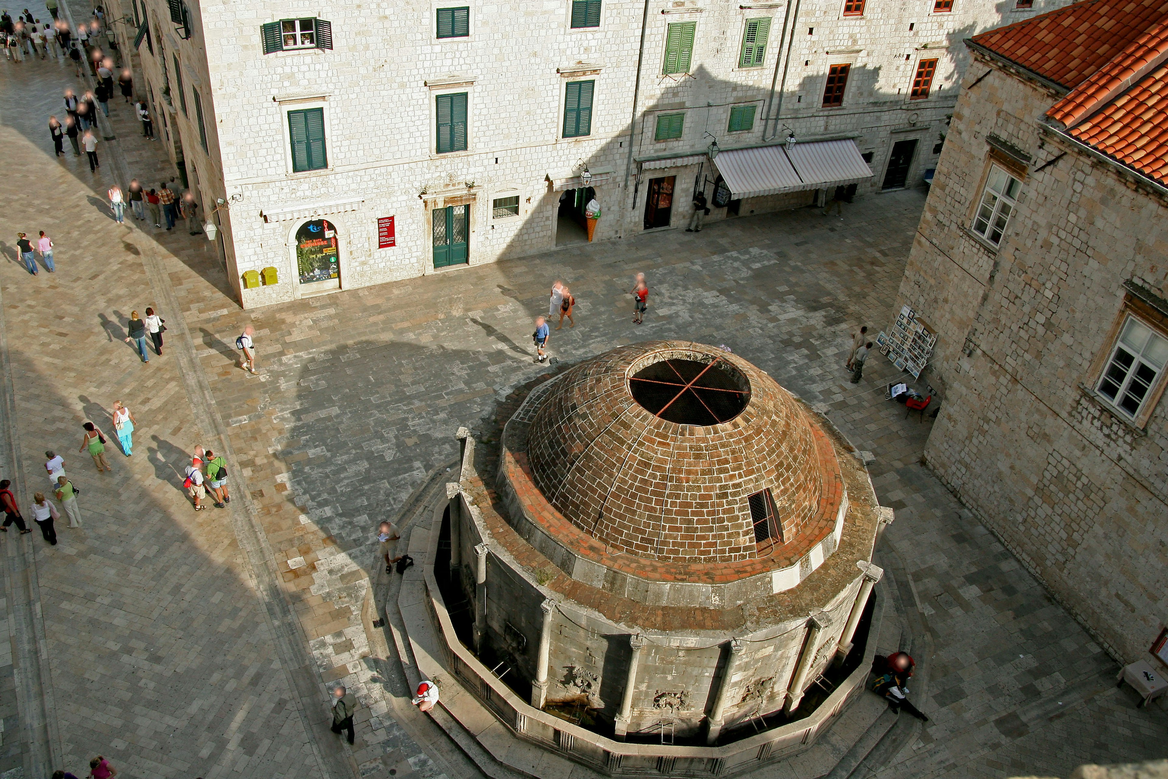 Stone dome structure in Dubrovnik's old town with surrounding people