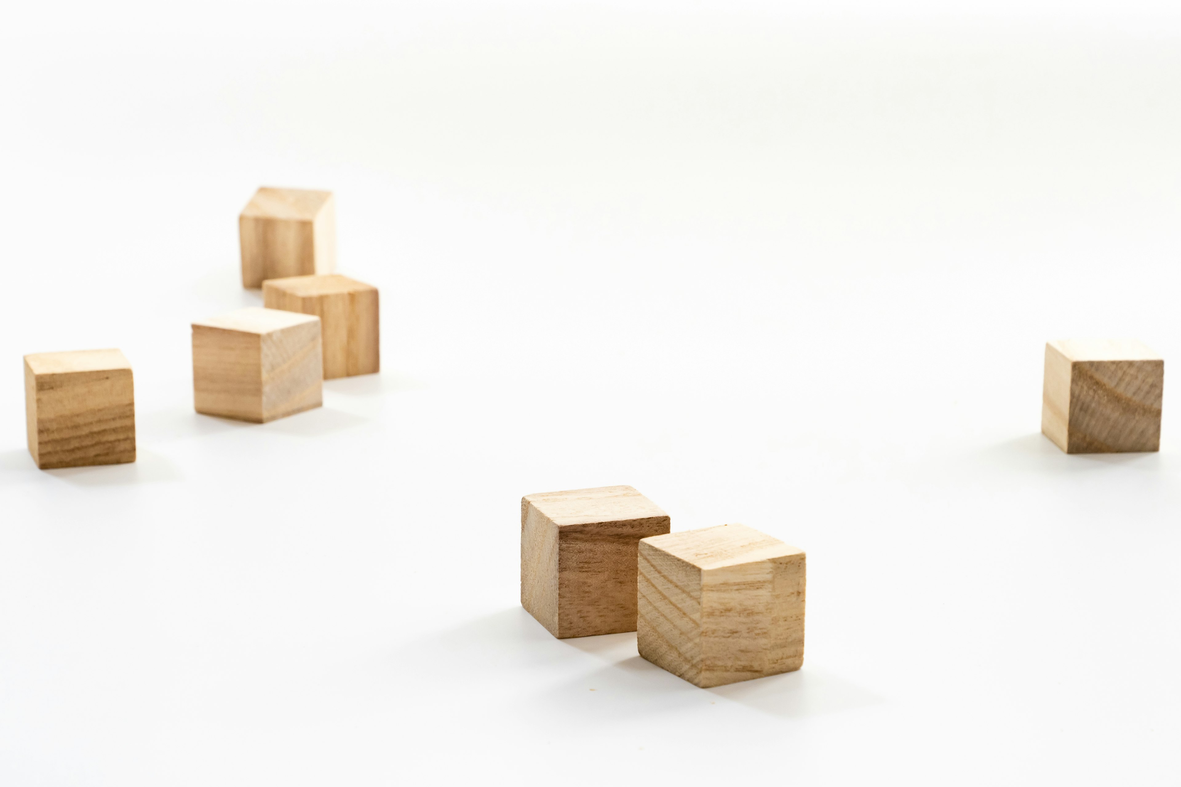 Simple image of wooden blocks arranged on a white background