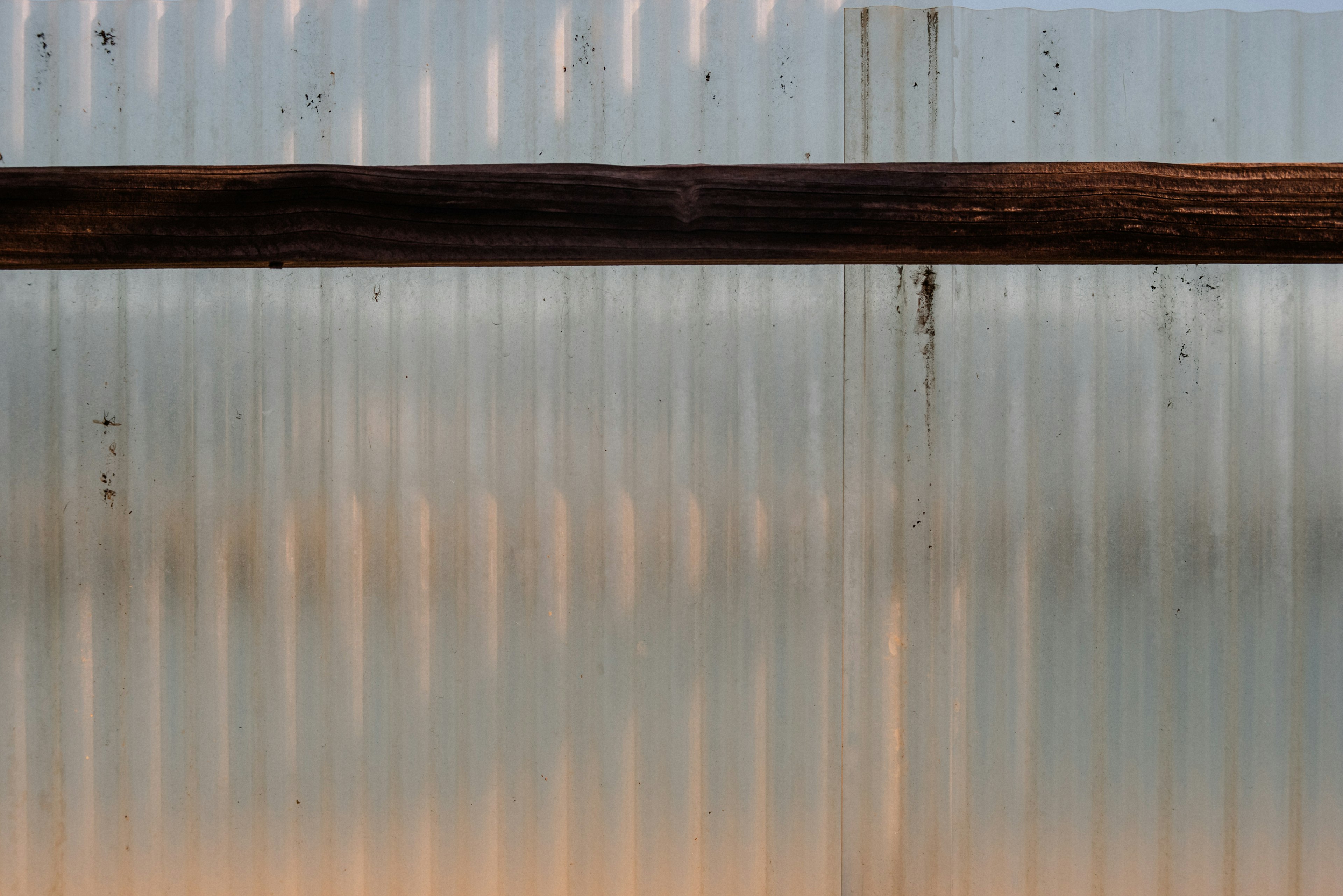 Translucent plastic wall with wooden beam structure