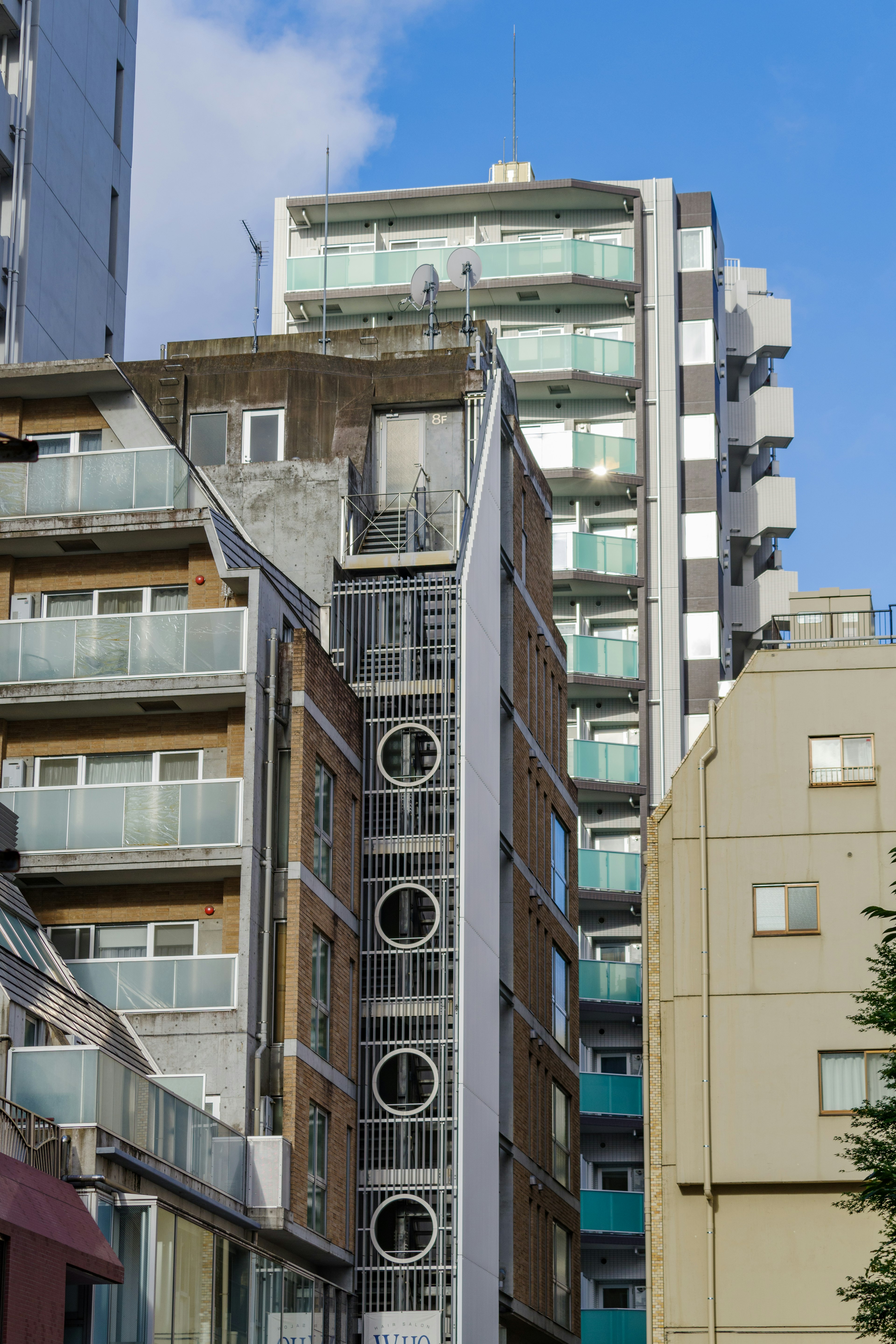 Urban landscape with high-rise buildings under blue sky featuring modern architecture