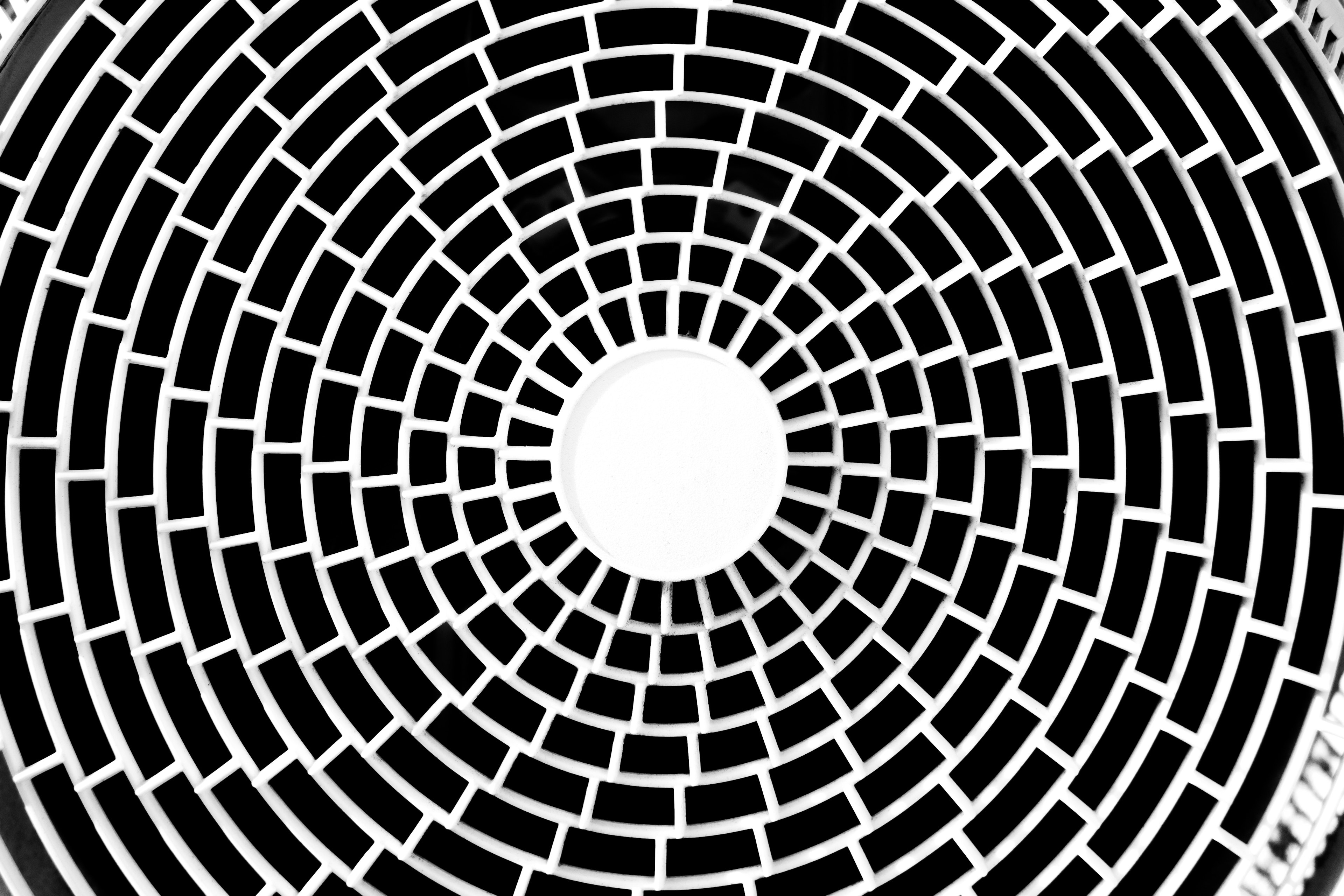 Circular pattern with black and white grid design