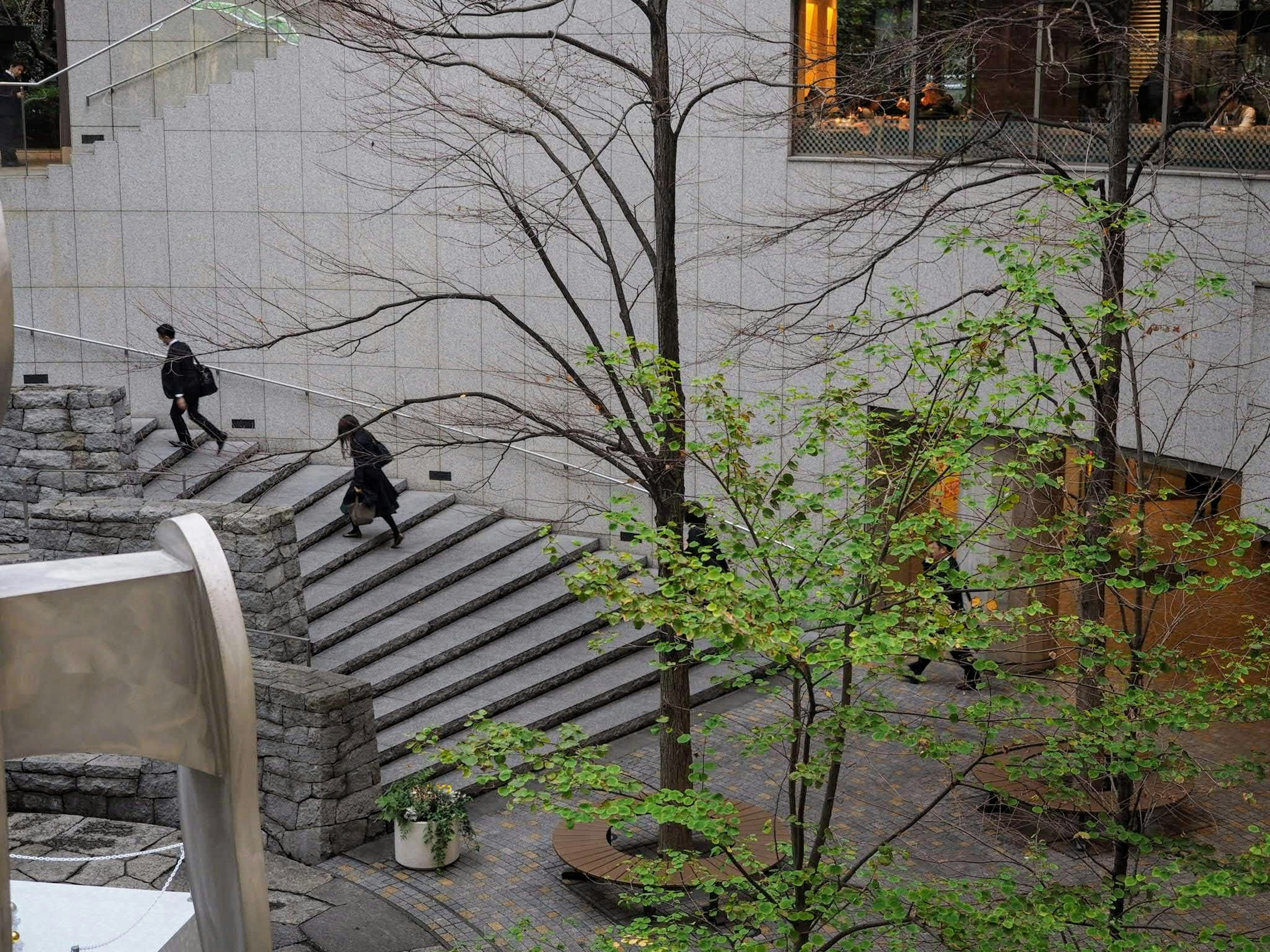 Urban scene with people walking down stairs