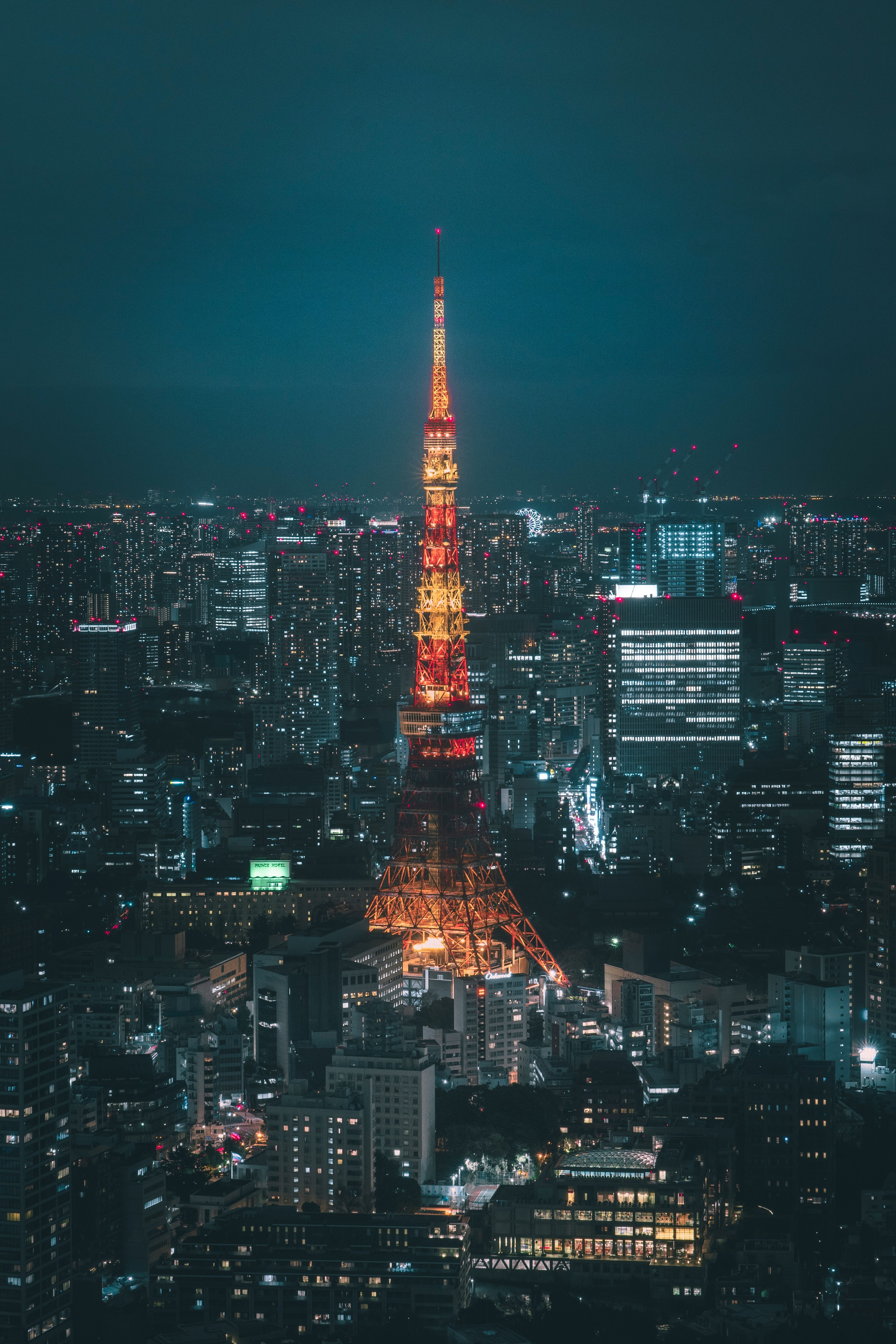 Tokyo Tower illuminated at night with city skyline