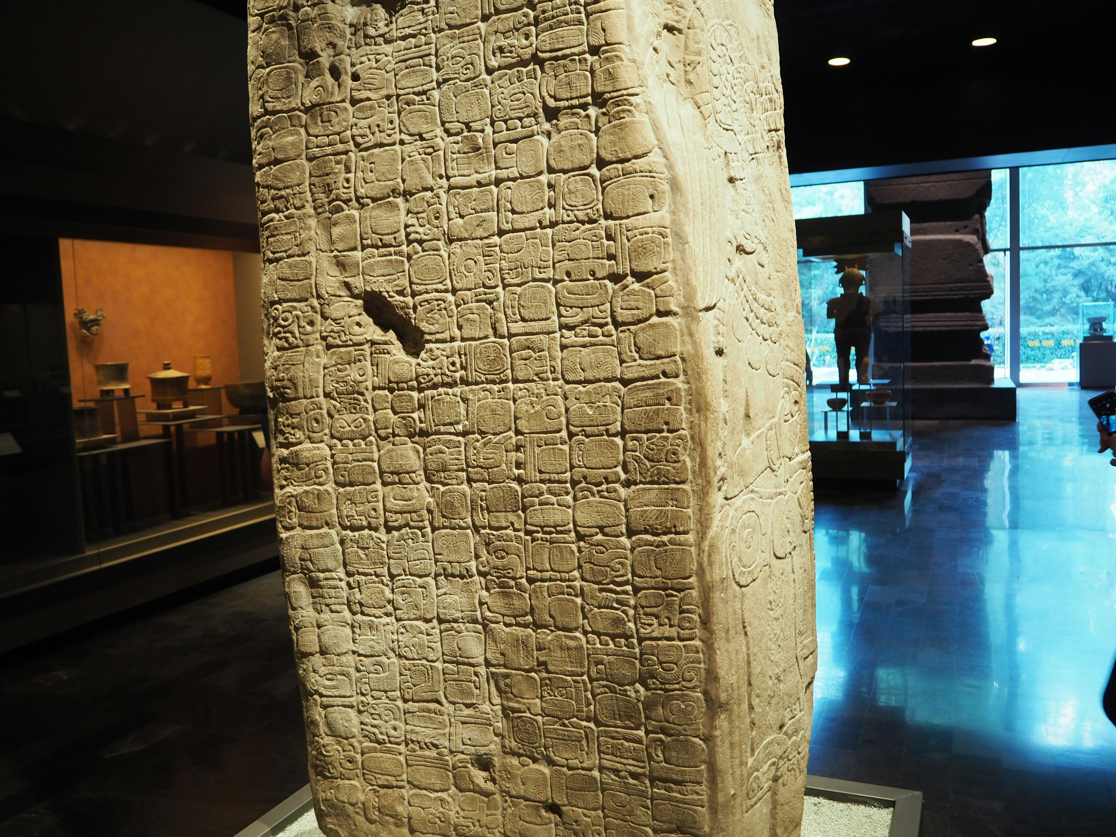 Ancient clay tablet displayed in a museum interior