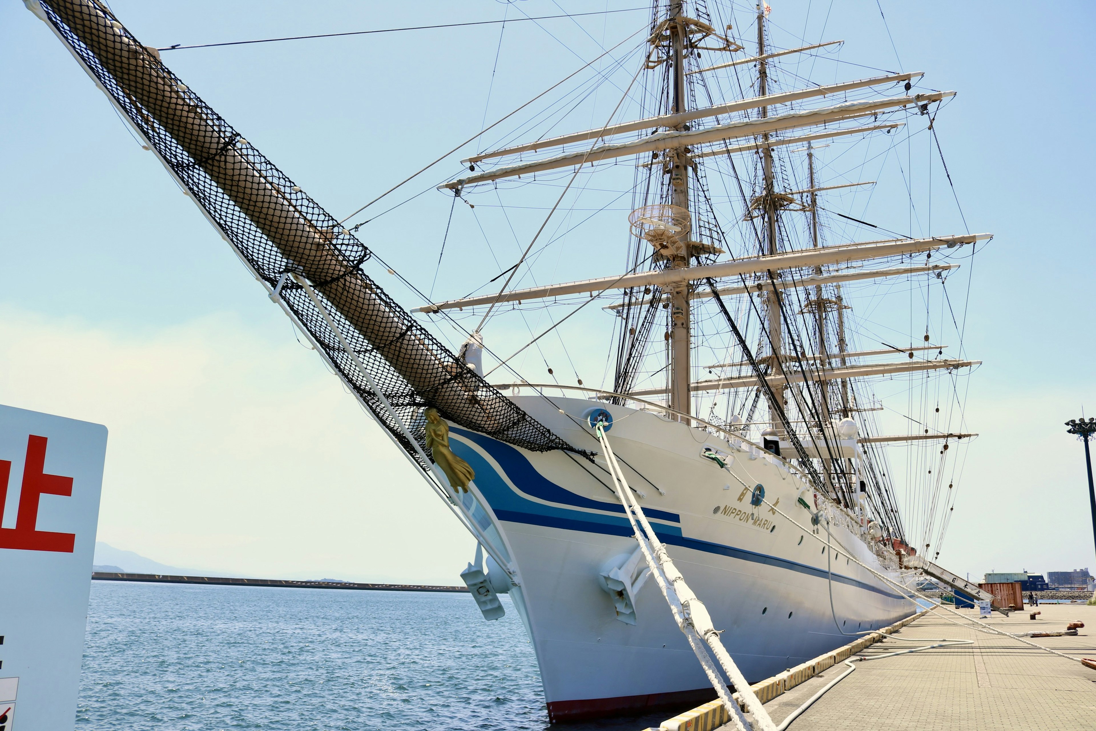 Large sailing ship docked at the port