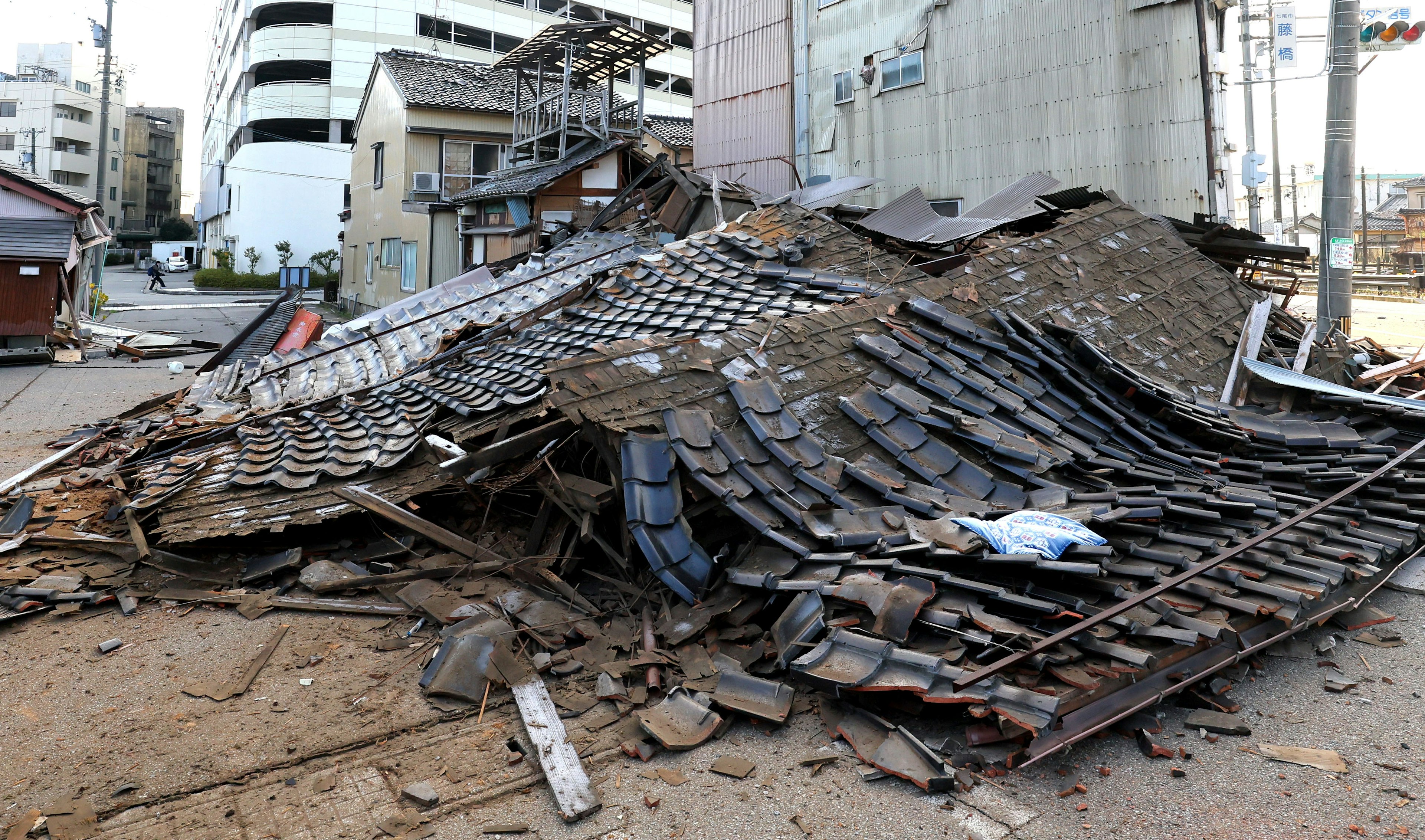 Scene of debris from a collapsed building scattered on the ground