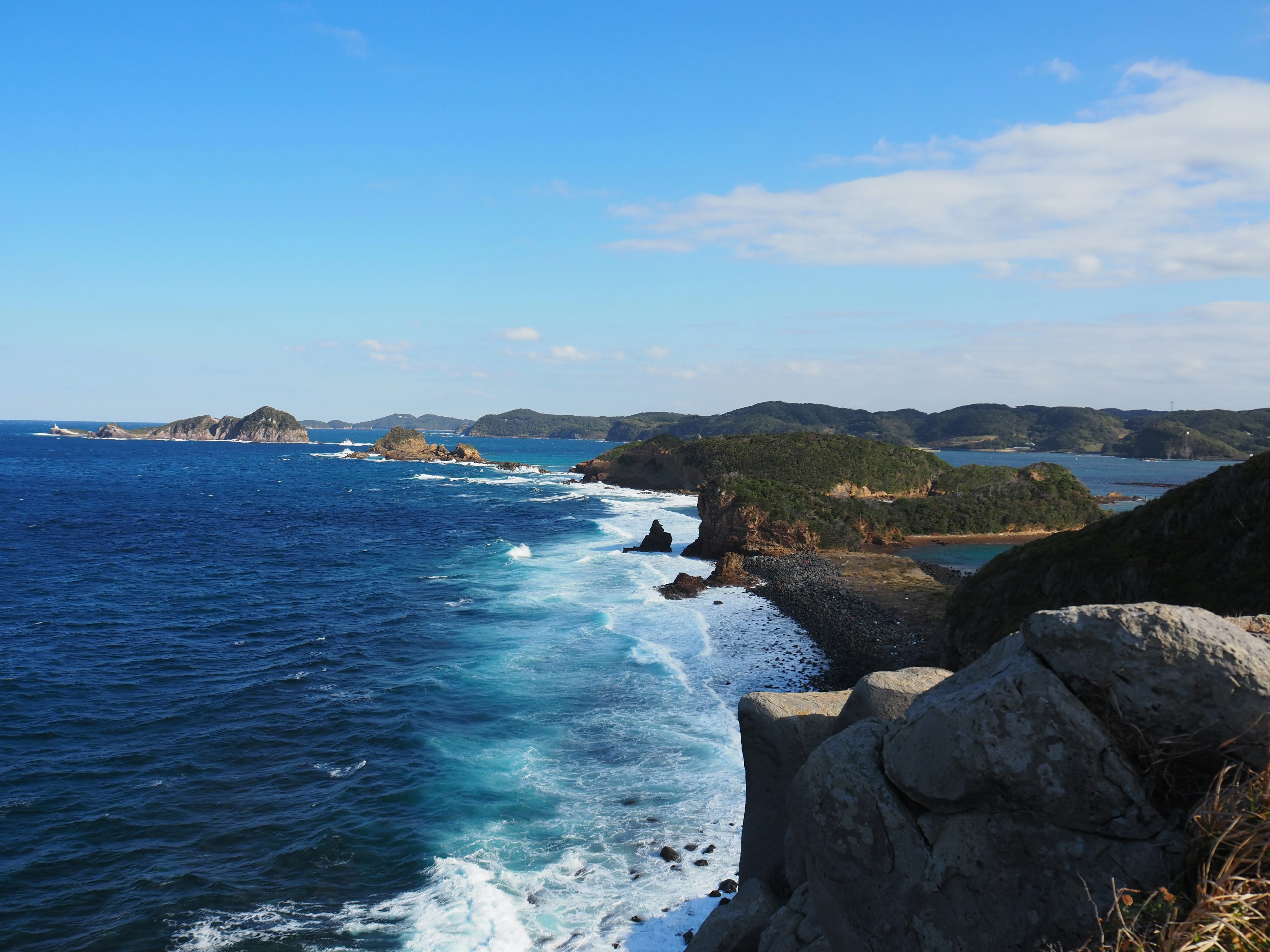 Coastal landscape with blue ocean and rocky shore