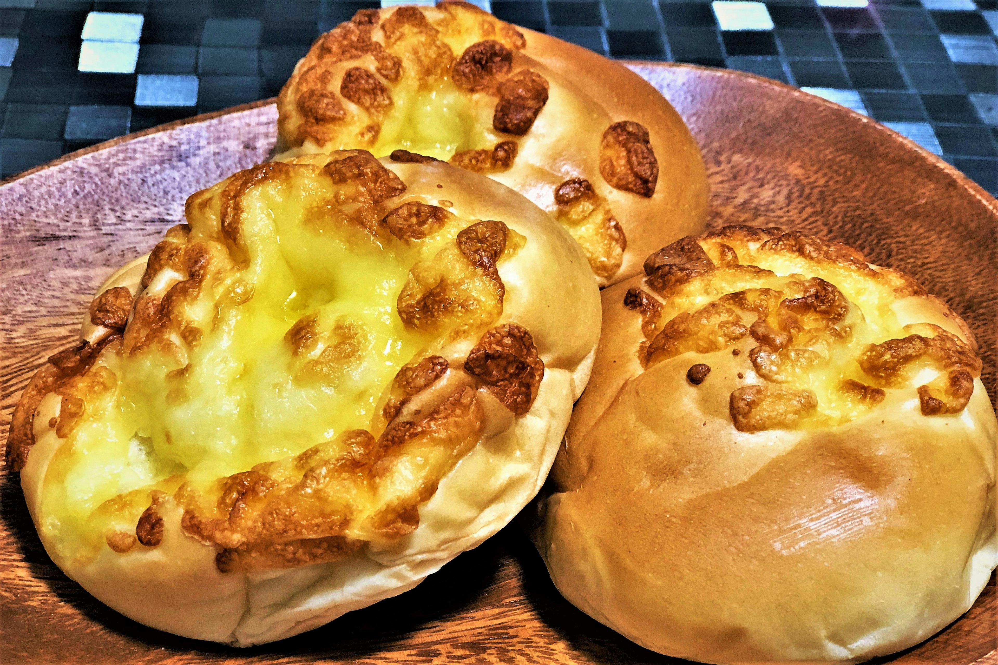 Freshly baked bread topped with melted cheese