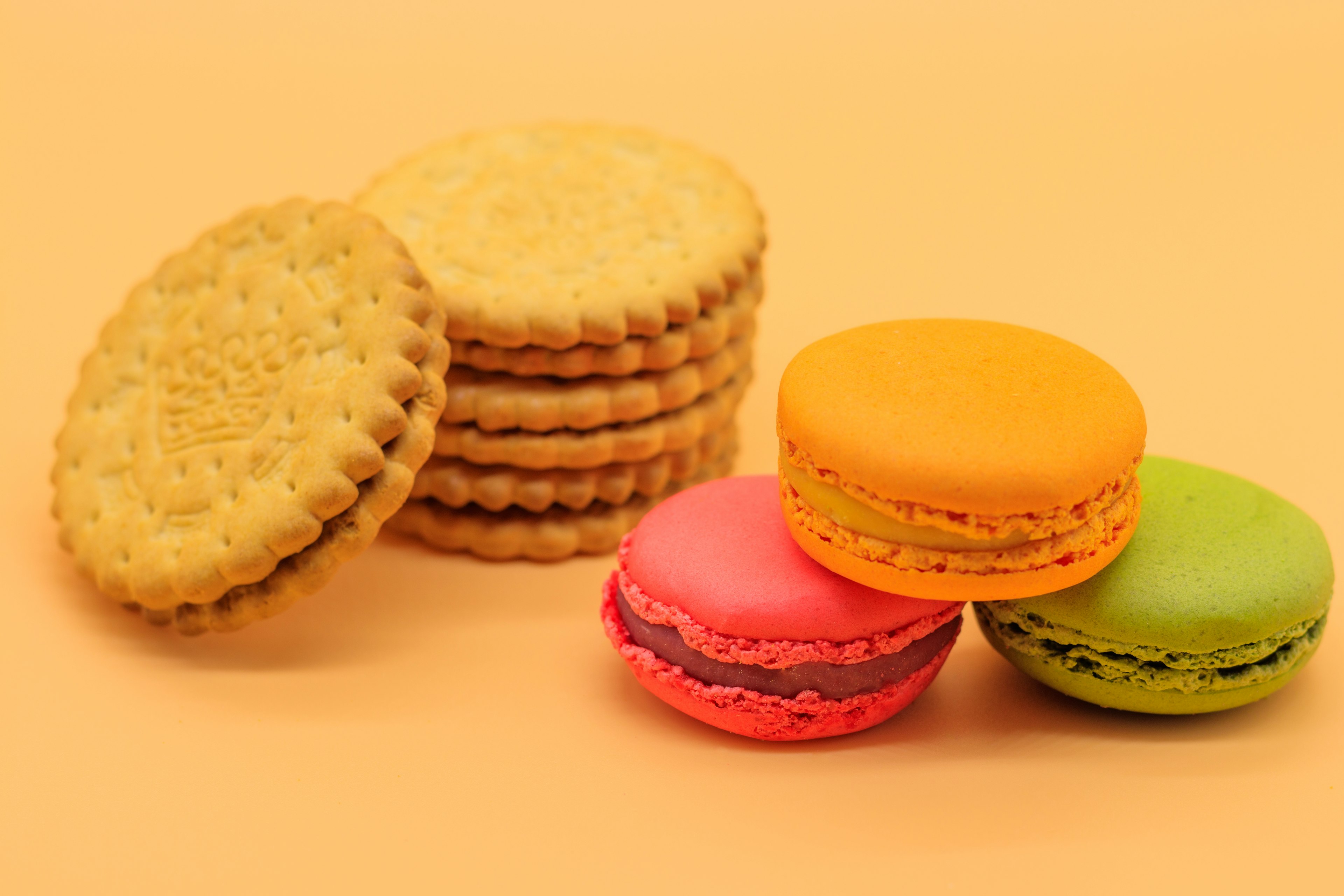 Colorful macarons and a stack of cookie biscuits