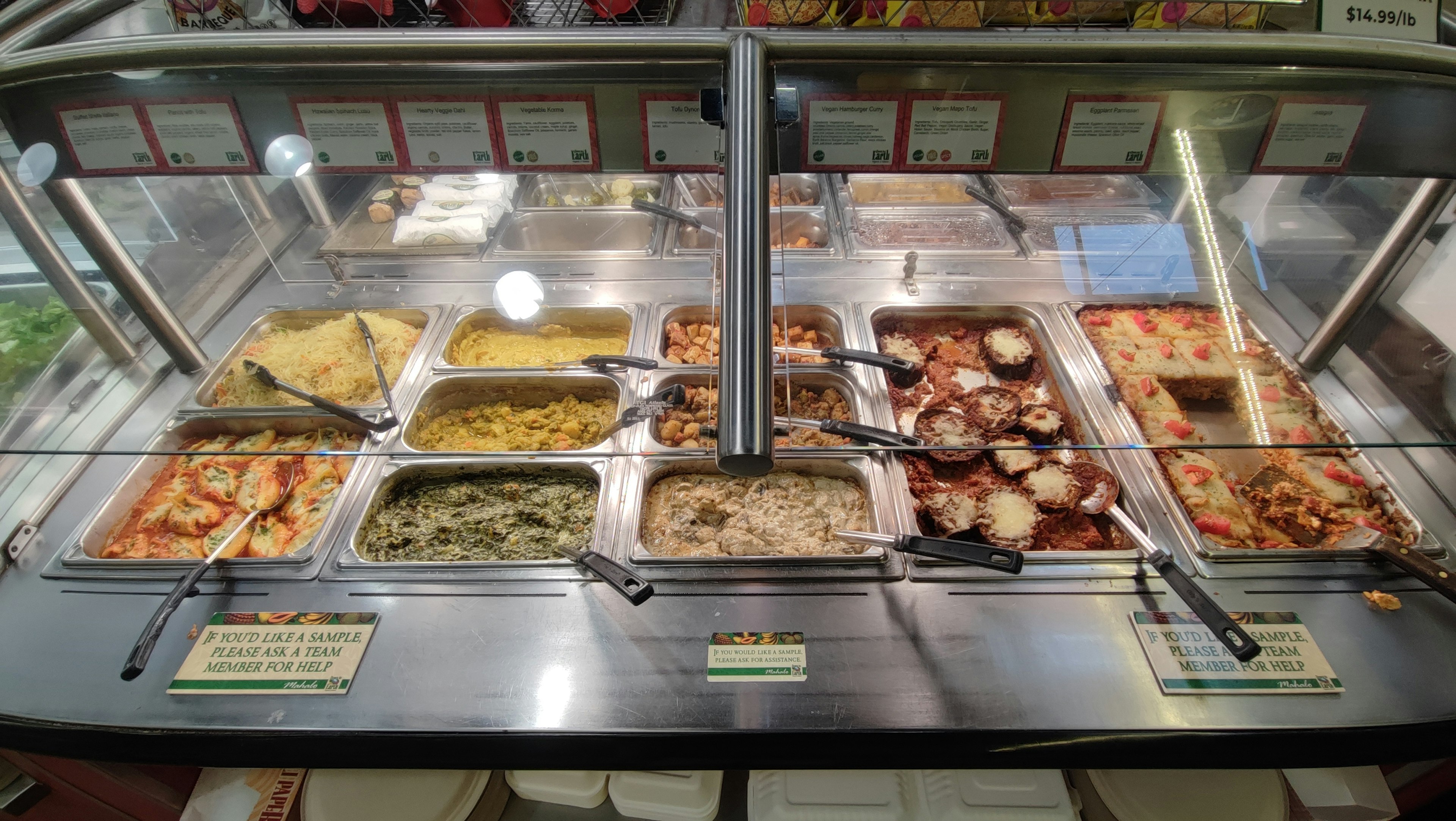 Buffet style counter featuring a variety of delicious dishes