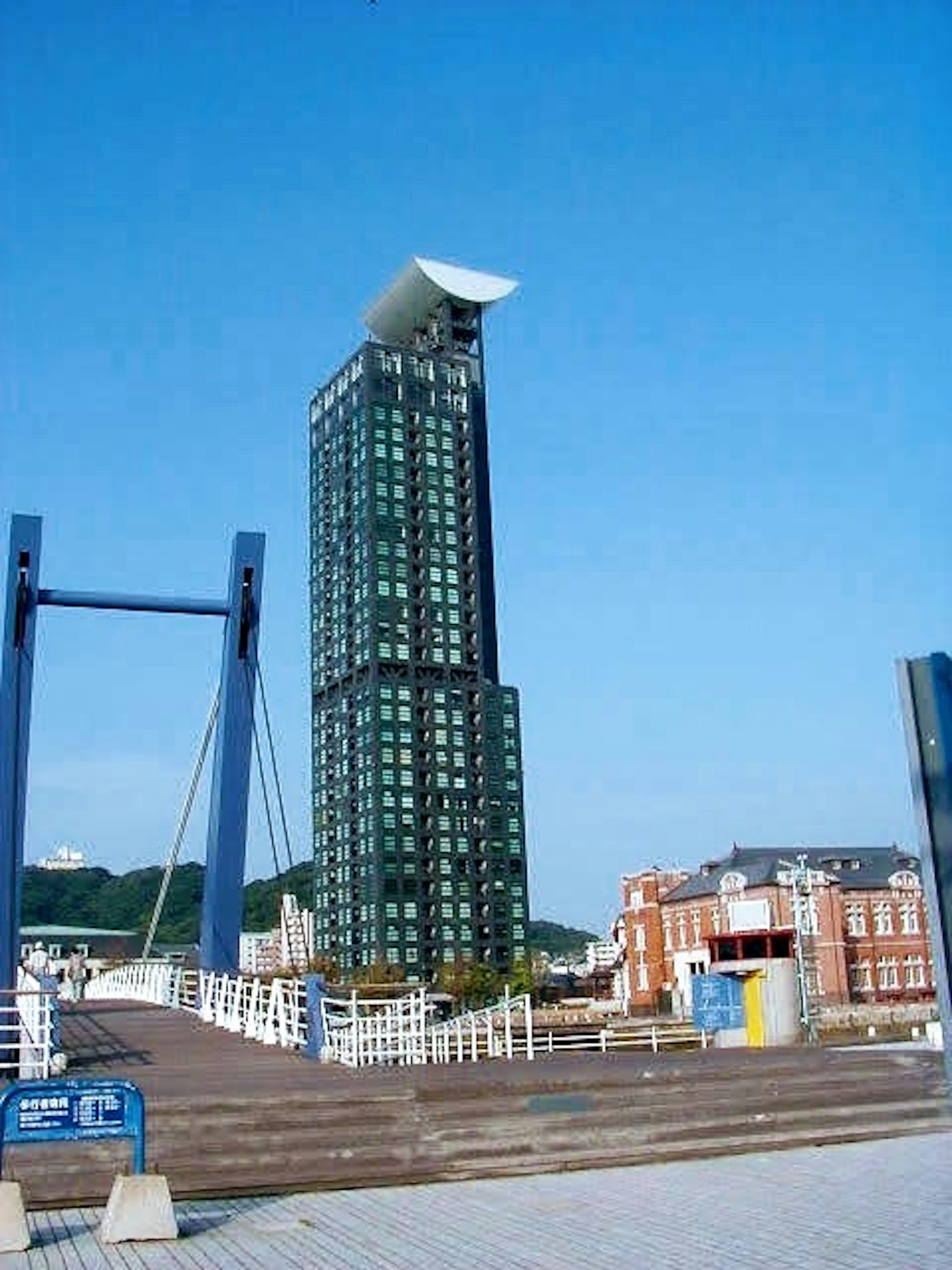 Modern skyscraper with blue sky backdrop