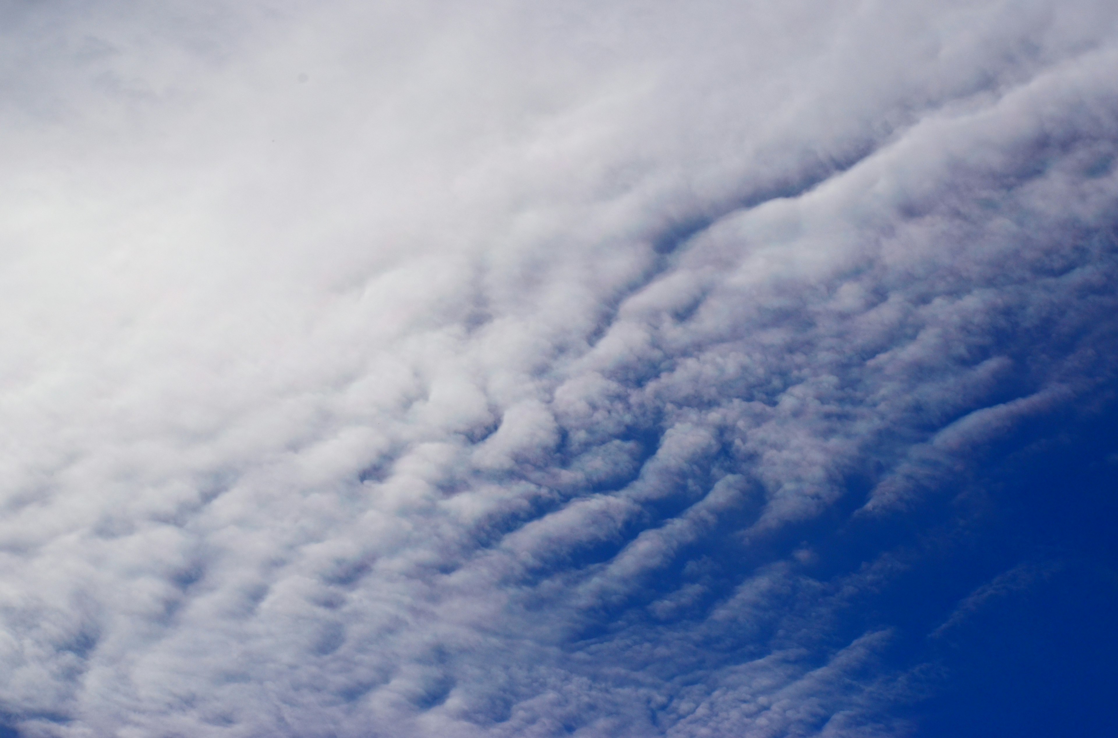 Patterns of white clouds in a blue sky