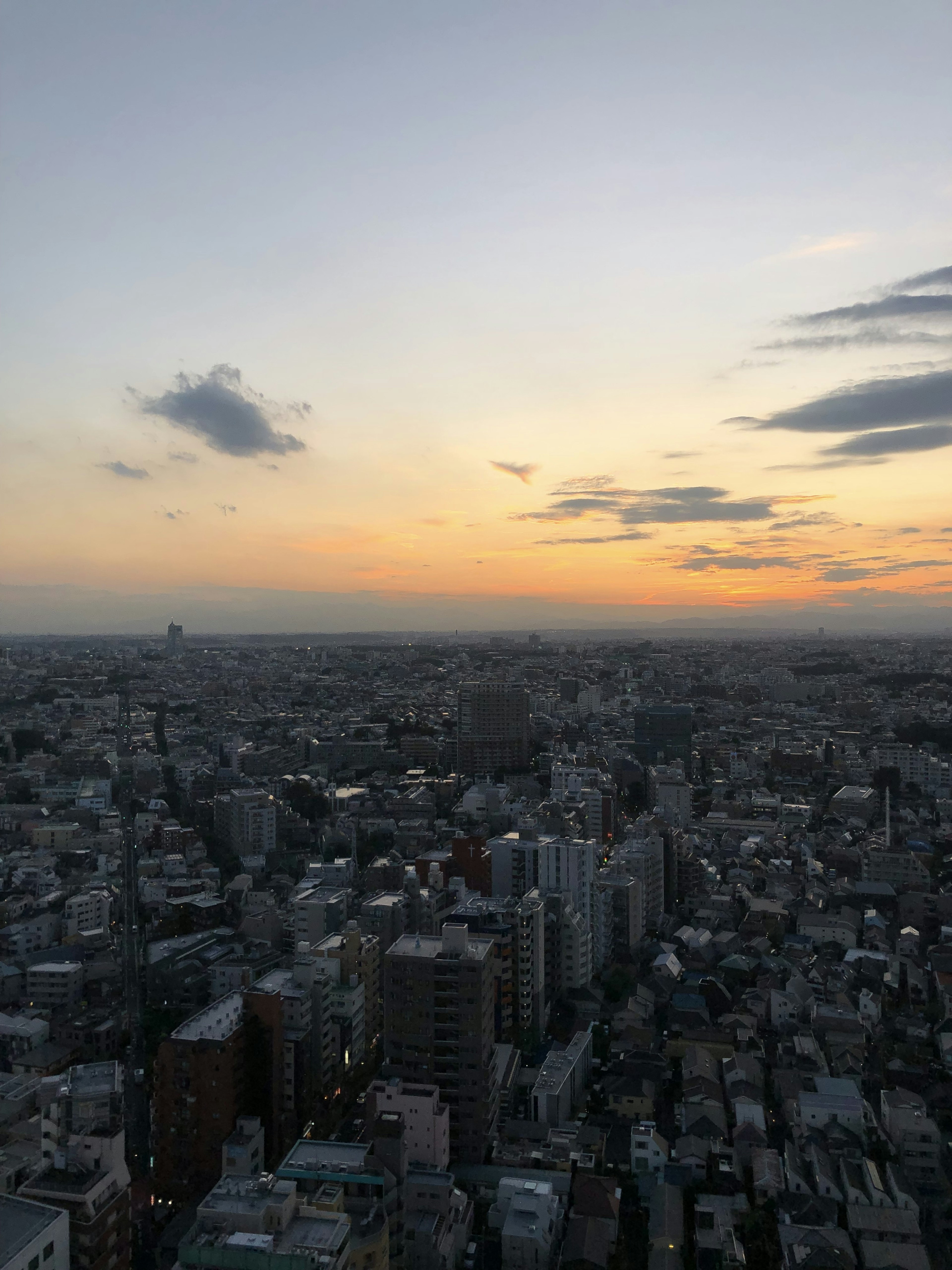 Cityscape at sunset with a colorful sky