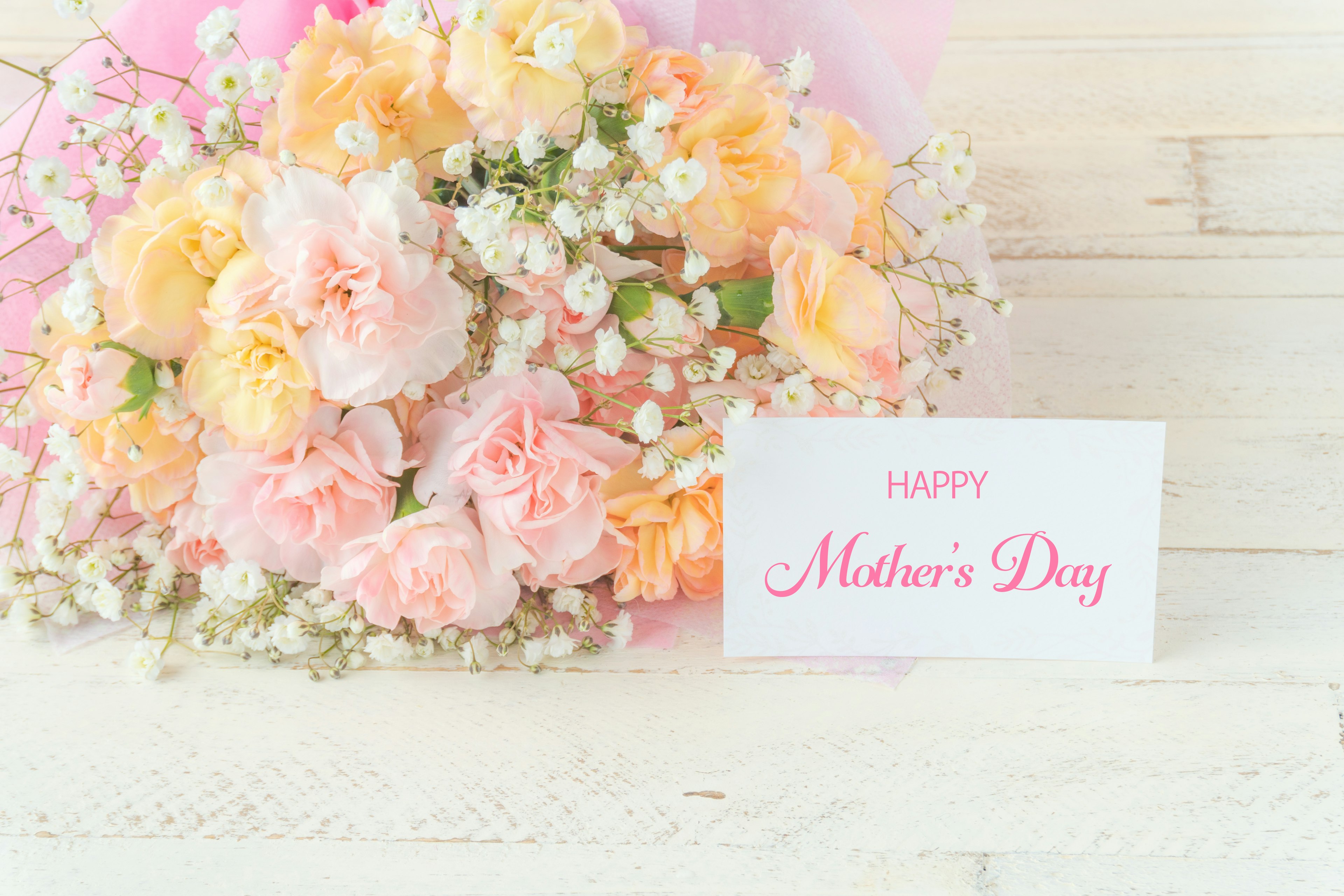 Bouquet of pink and orange flowers with a Happy Mother's Day card