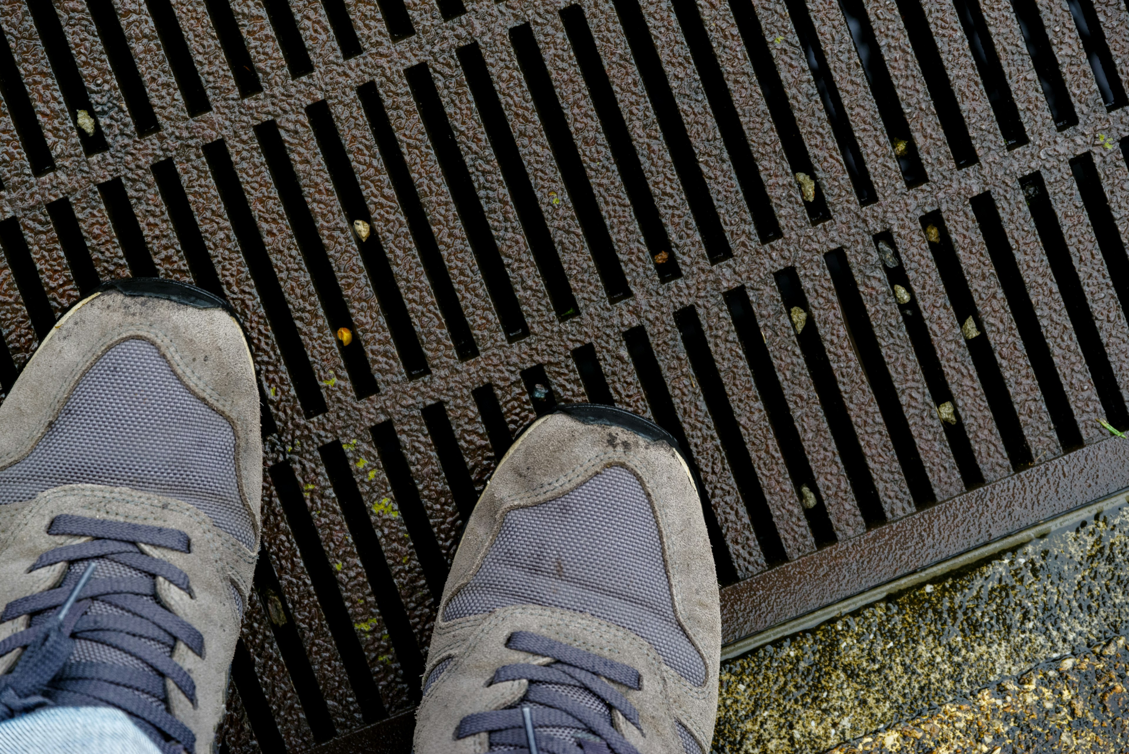 Perspective view of shoes on a grate