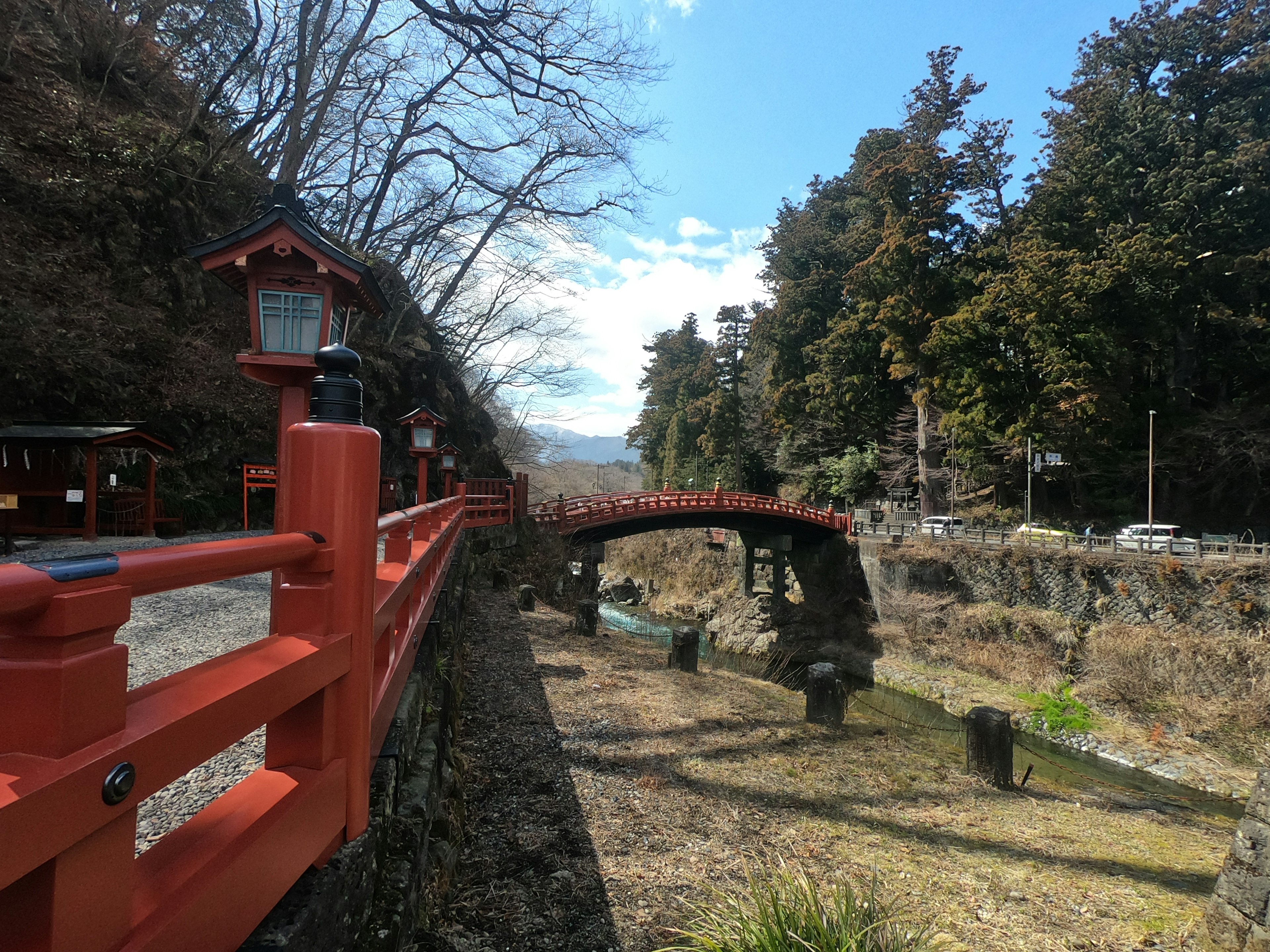 Scenic view featuring a red bridge and lush greenery