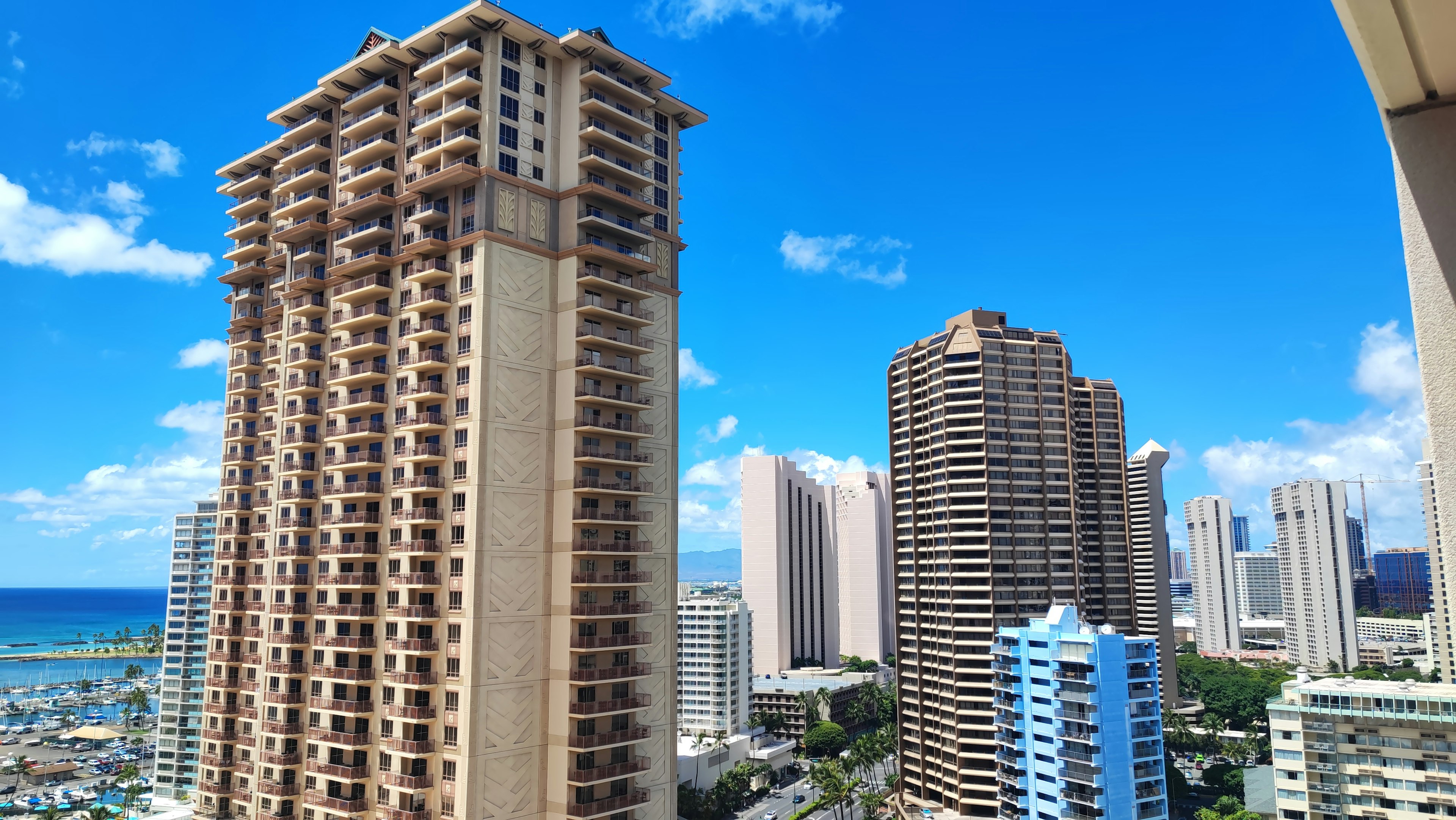 Cityscape of Honolulu with high-rise buildings and blue sky