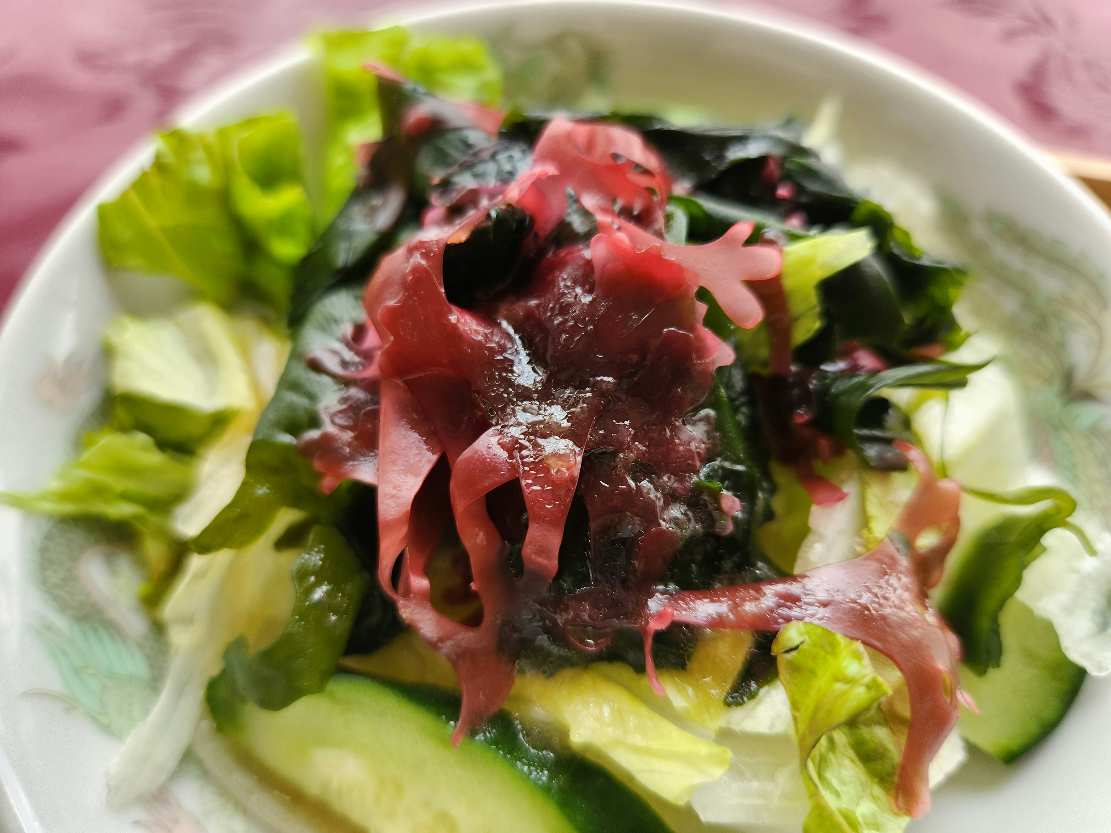 Fresh seaweed salad topped with sliced pickled ginger