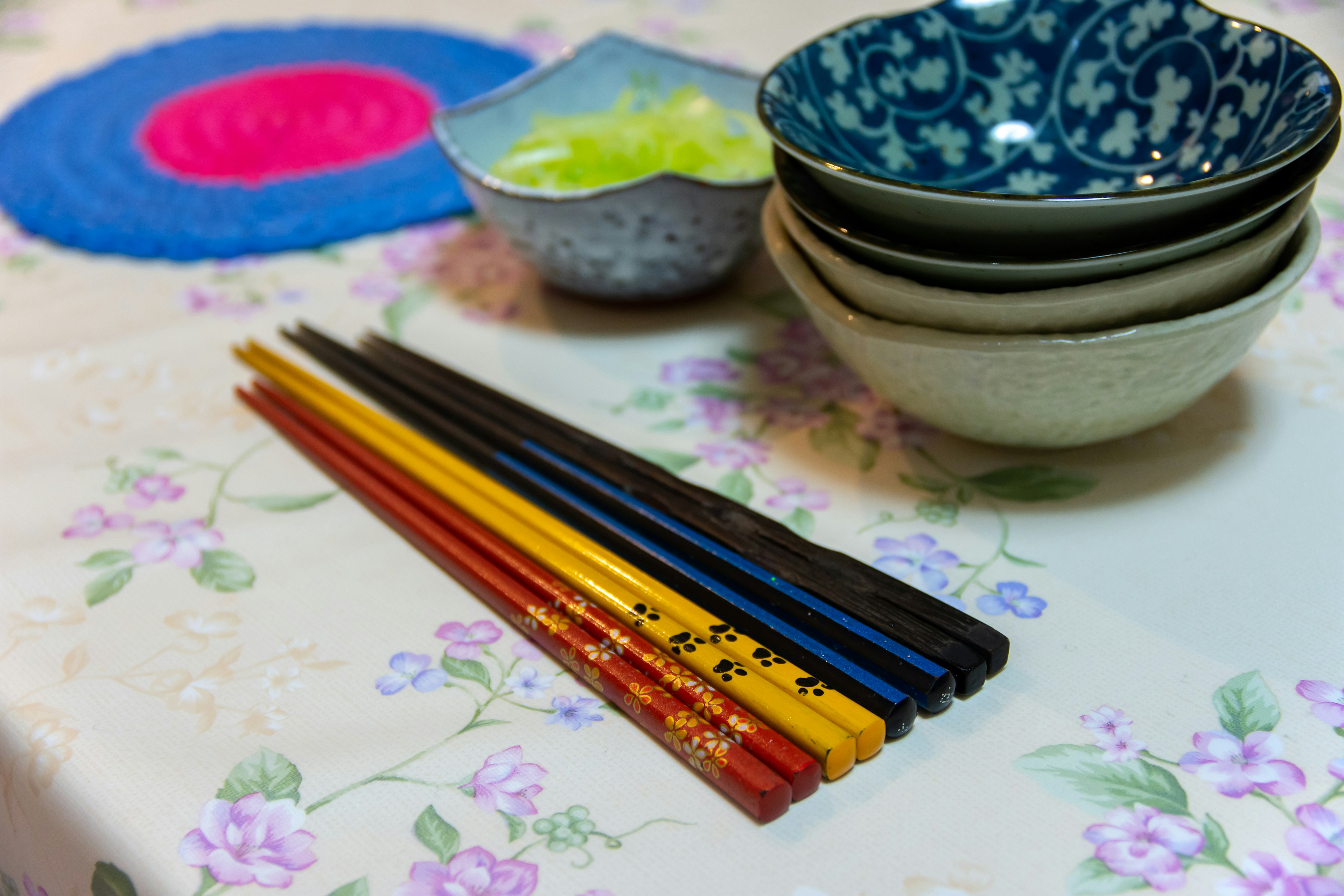 Colorful chopsticks and beautiful dishes arranged on a table