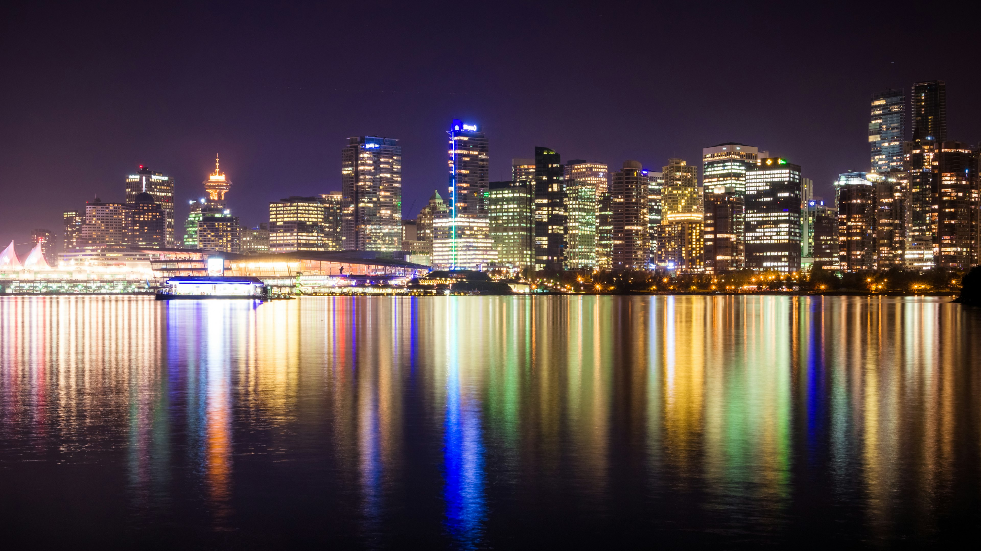 Beautiful city skyline at night with reflections on the water