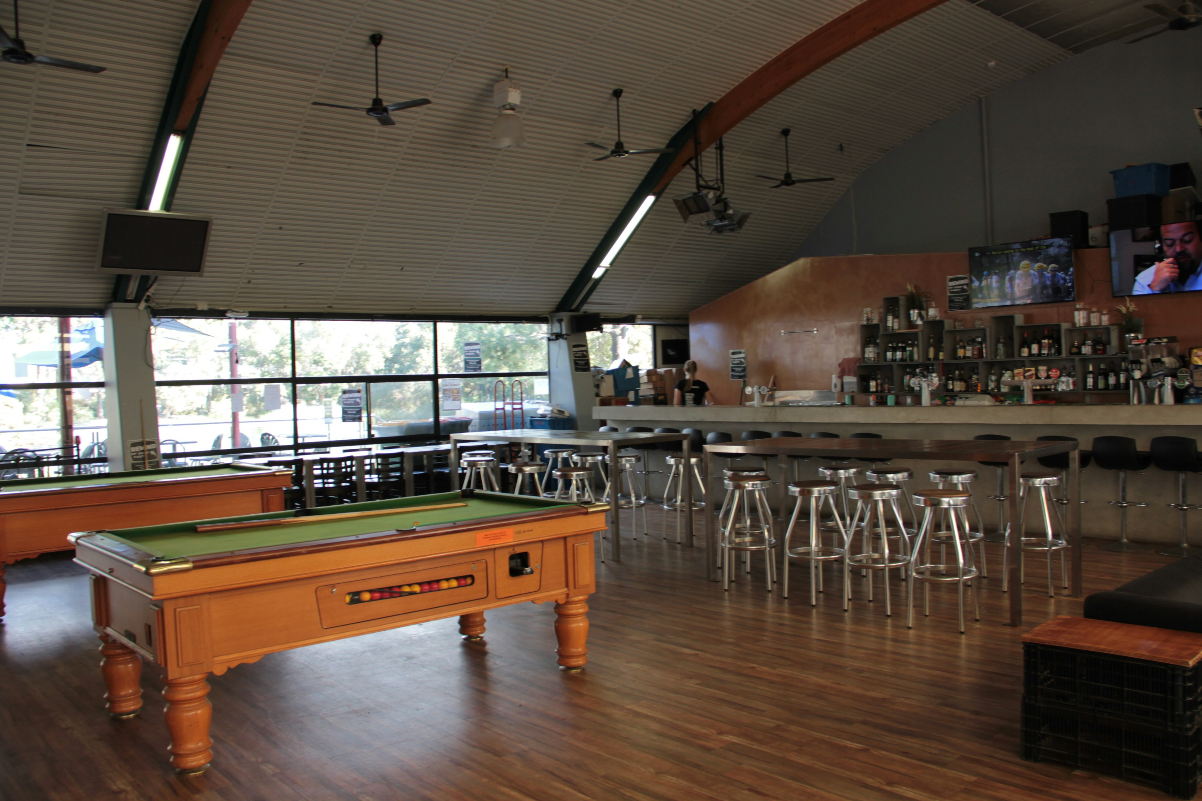 Spacious bar area featuring a pool table and a counter