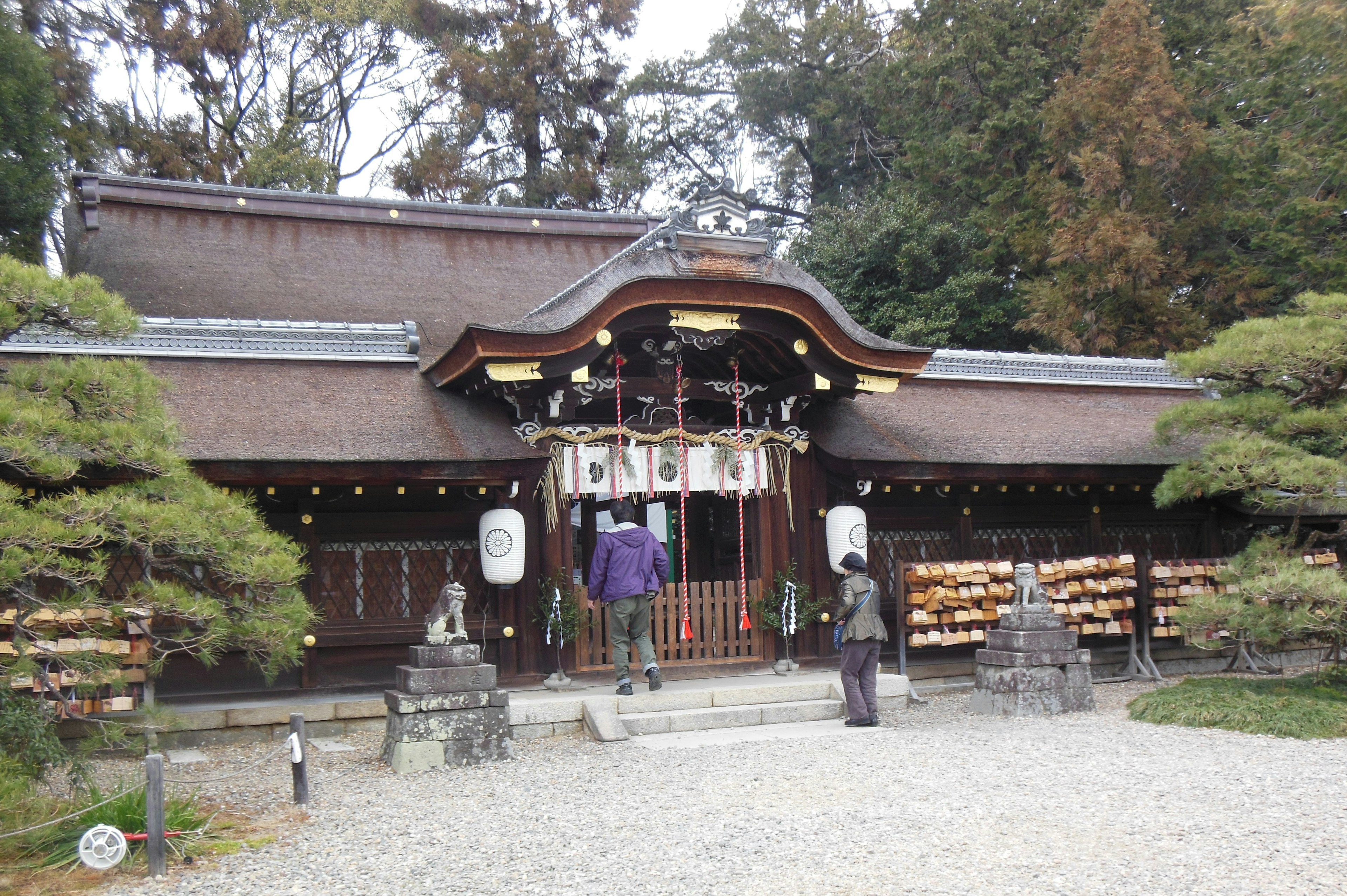 Traditional shrine building in a serene landscape