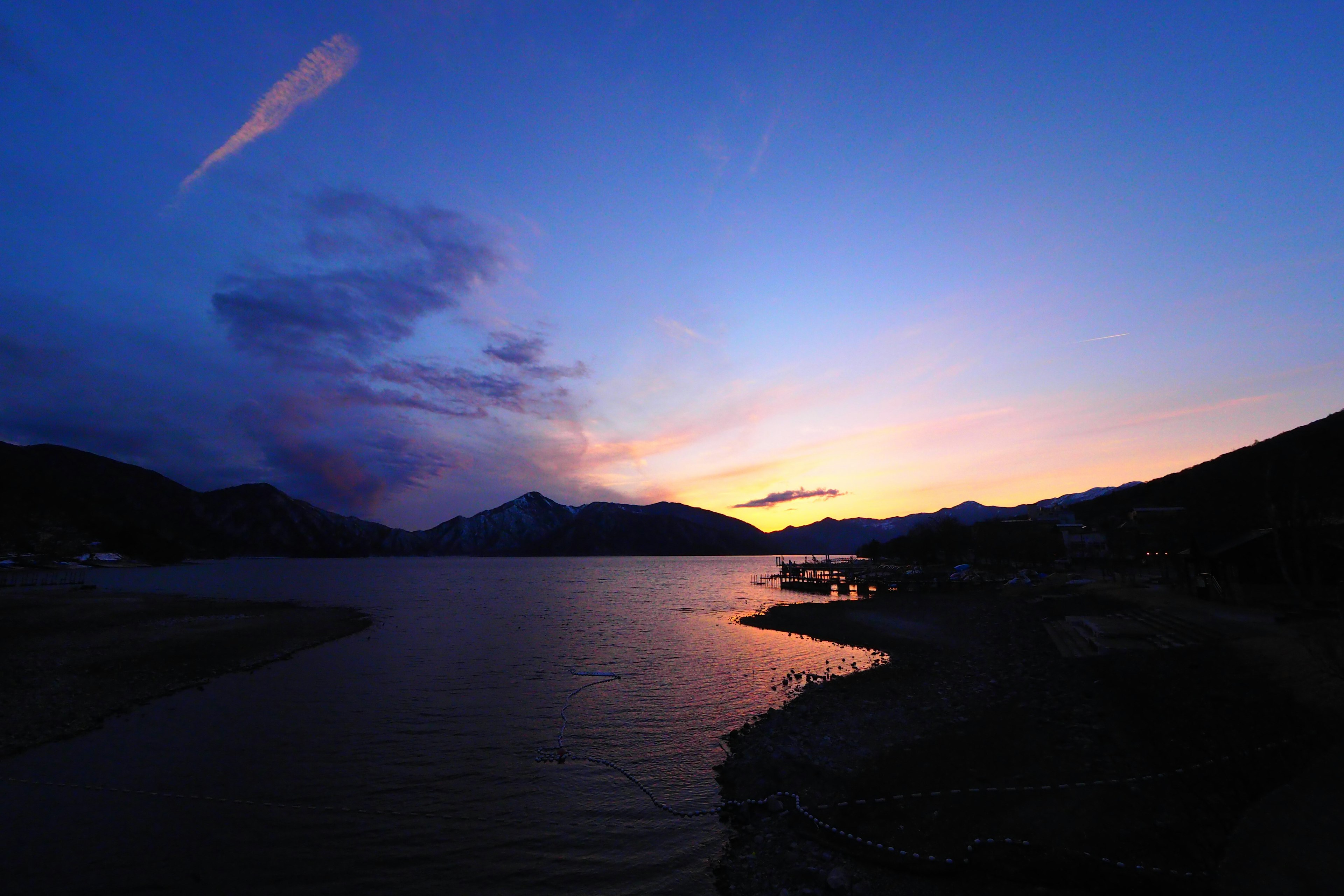 Beautiful sunset over a lake with mountains in the background