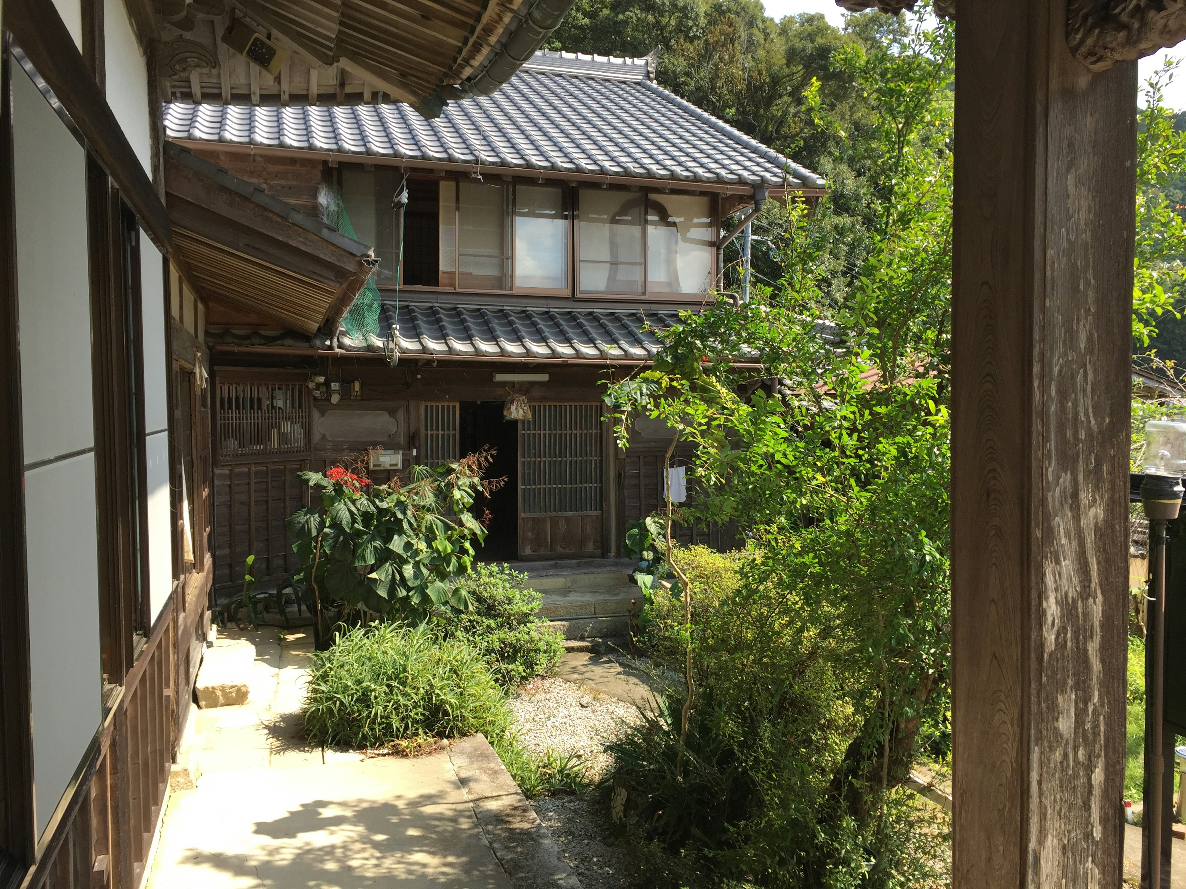 Traditional Japanese house with a lush green garden