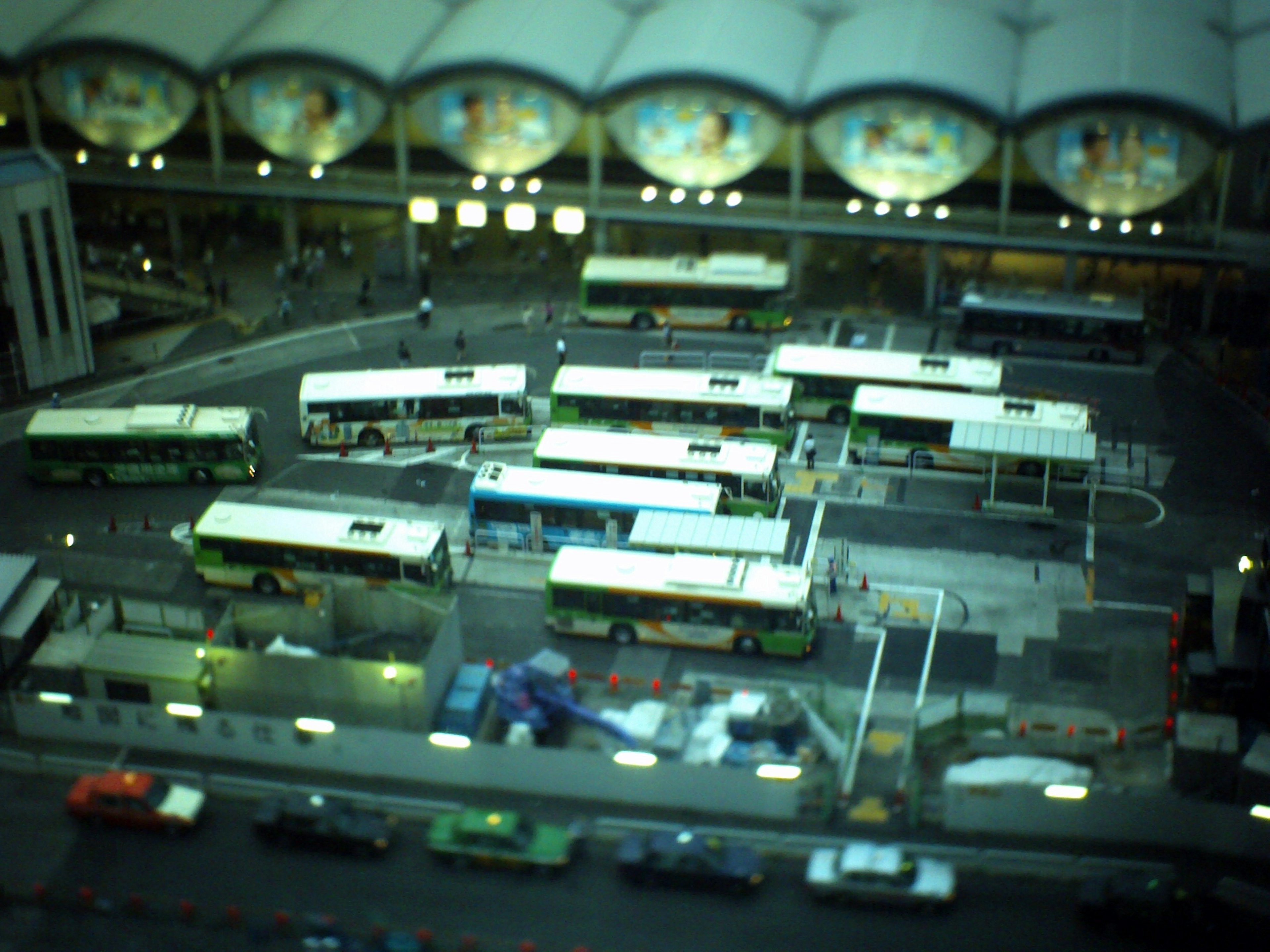 Aerial view of a bus terminal with multiple buses