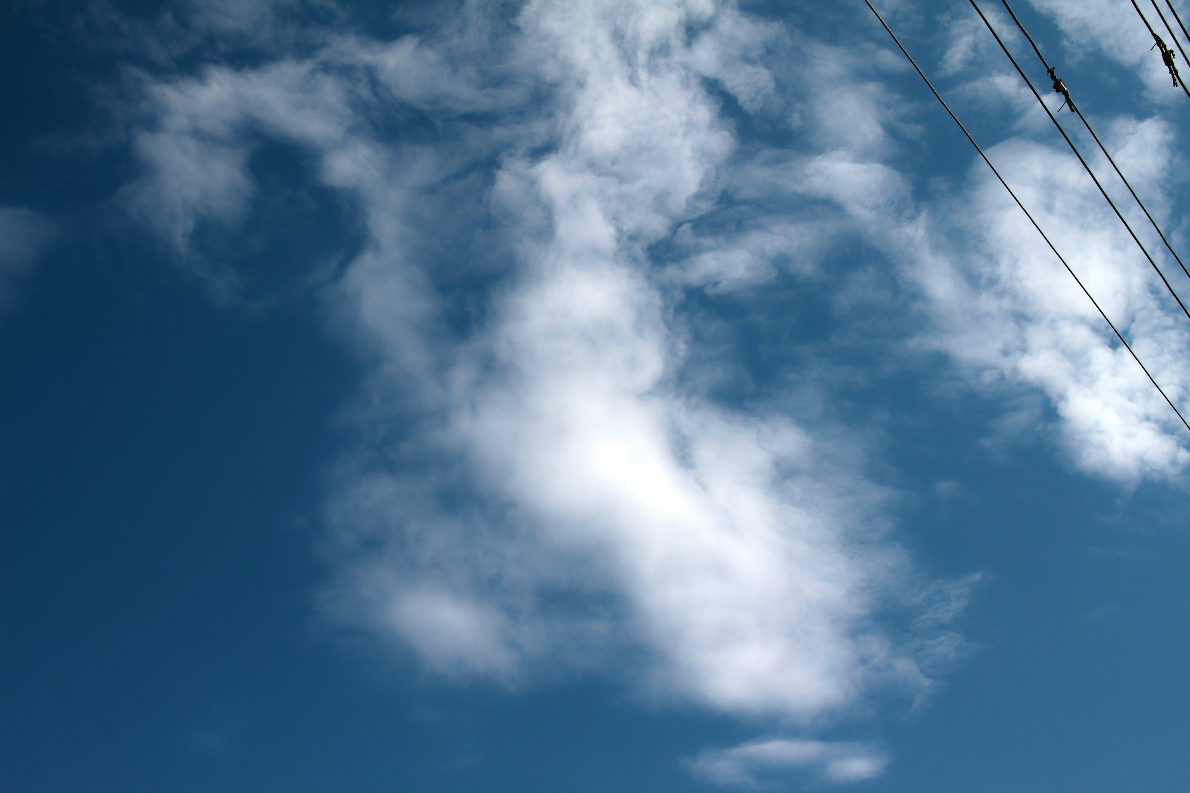 White cloud formations in a blue sky