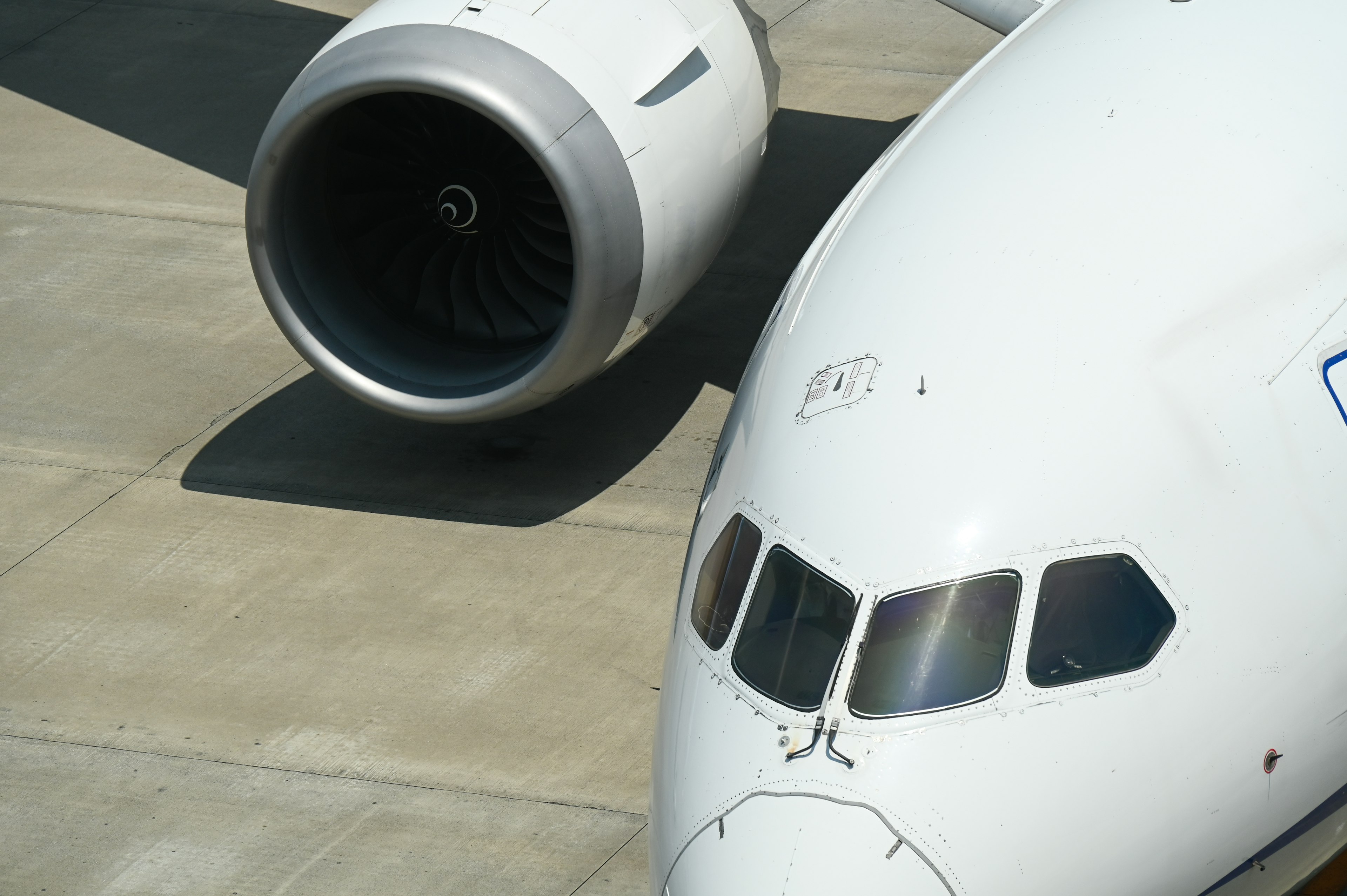 Close-up of an airplane engine and fuselage