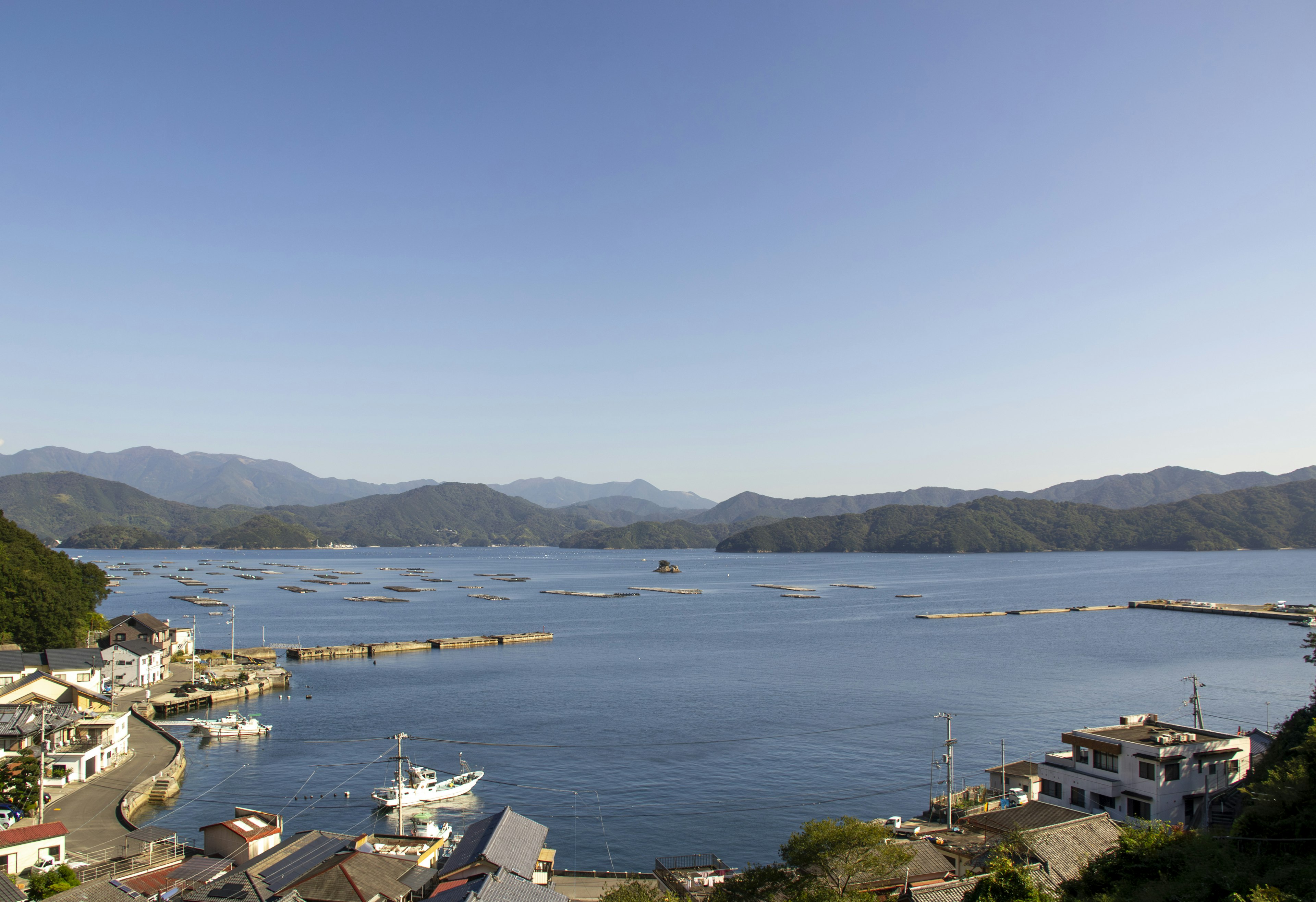 Scenic view of the ocean with mountains in the background