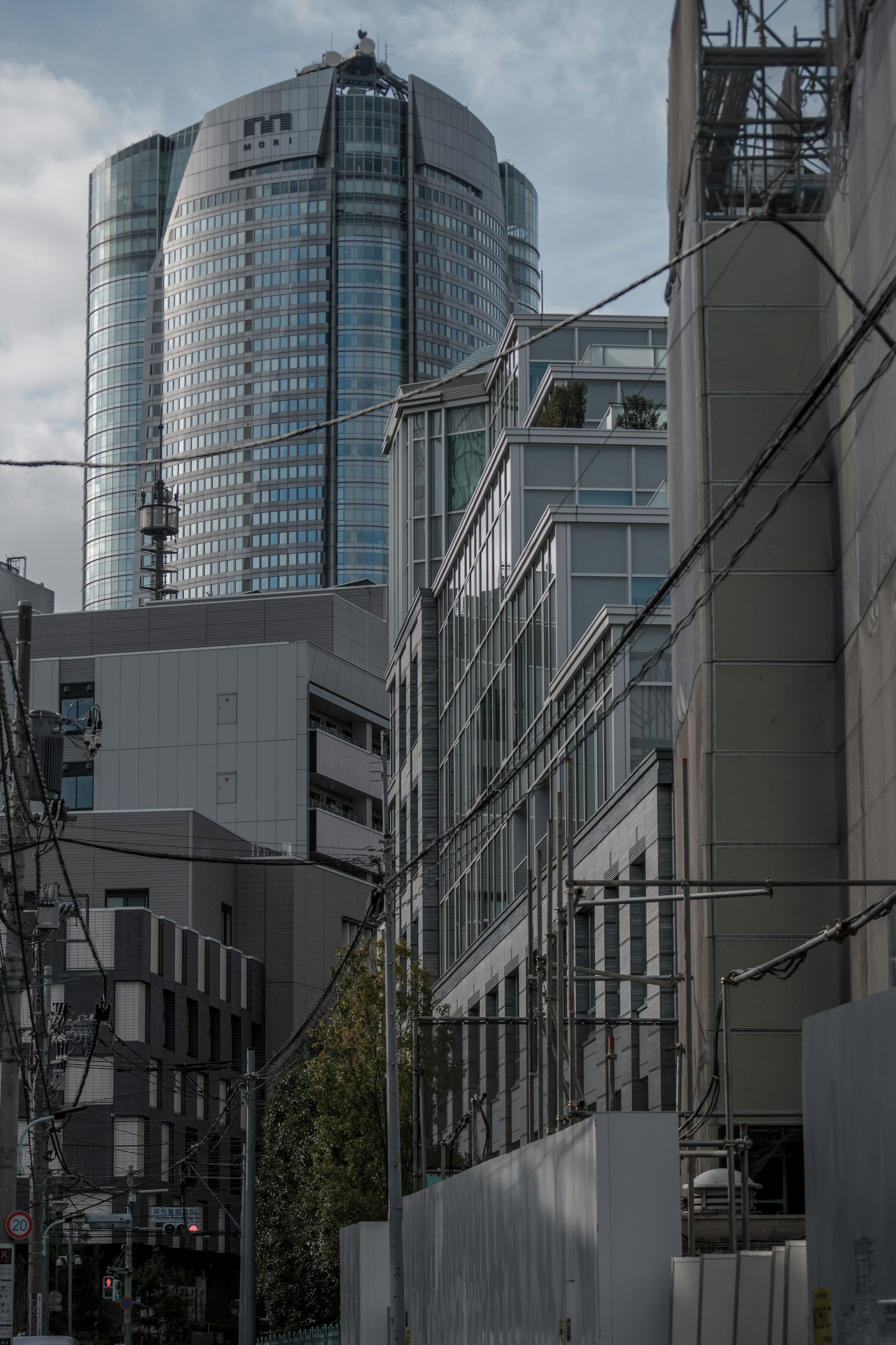 Cityscape featuring a tall skyscraper and modern buildings