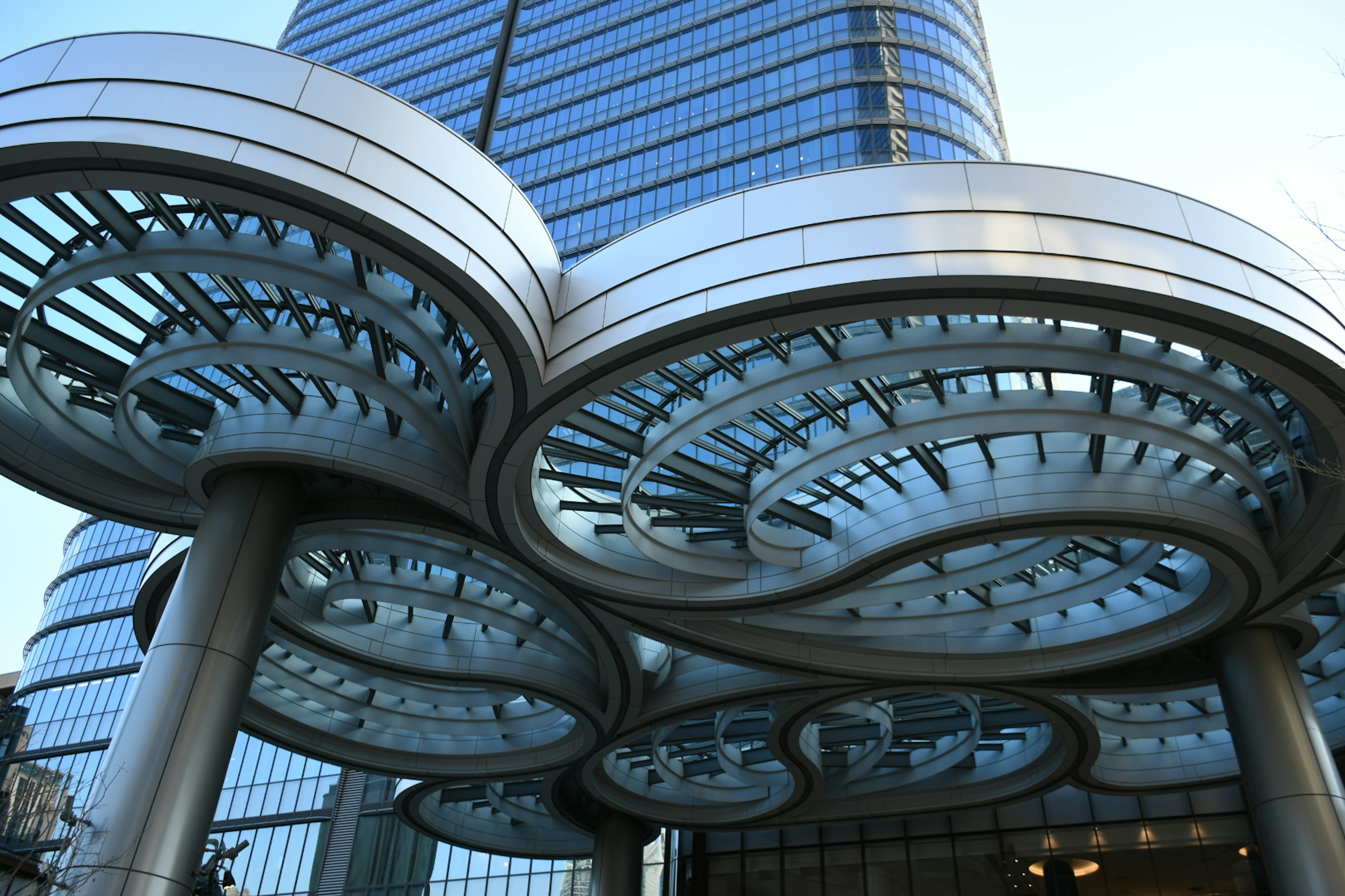 Unique metallic canopy structure of a modern building with circular patterns