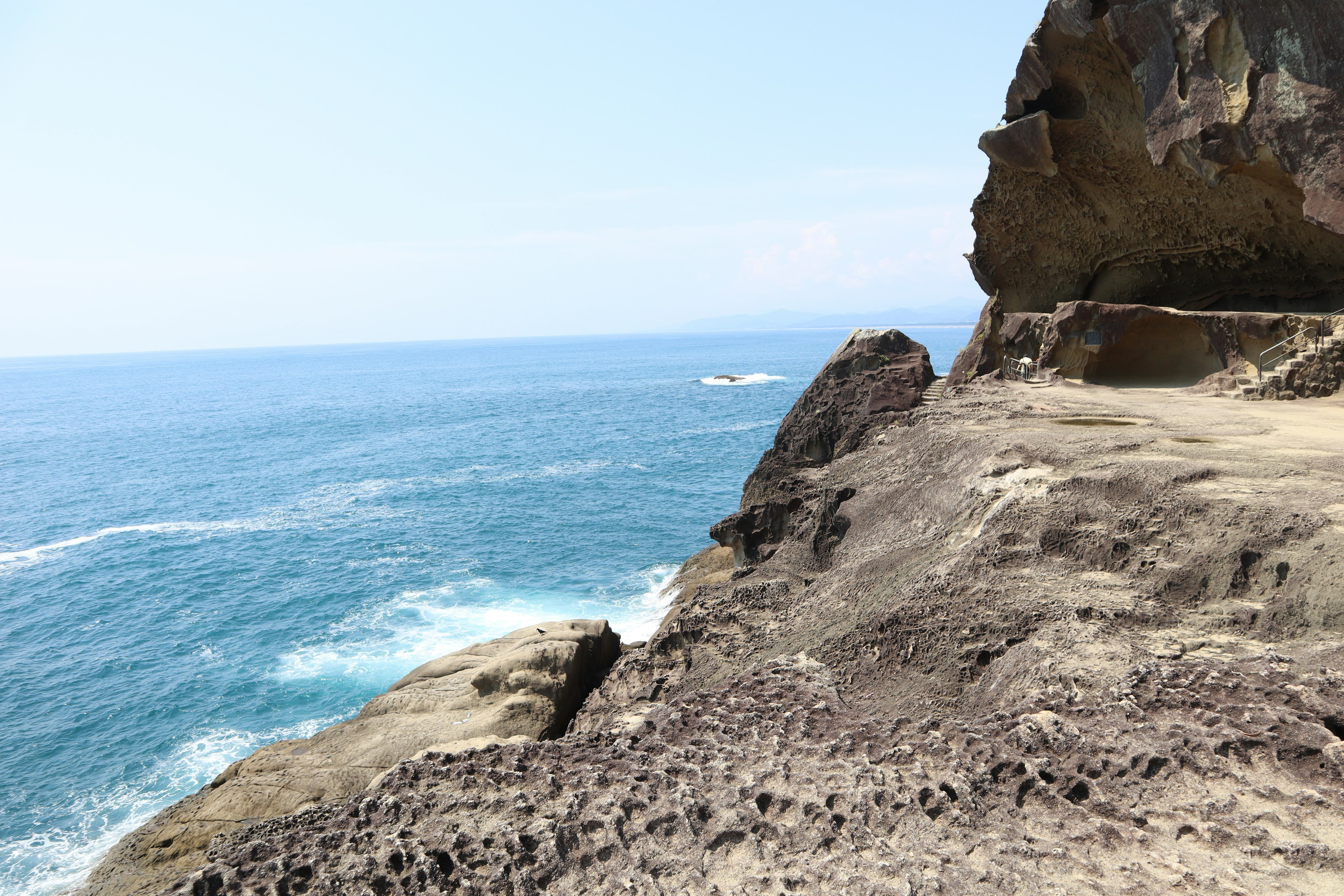 Coastal rocky landscape with blue ocean