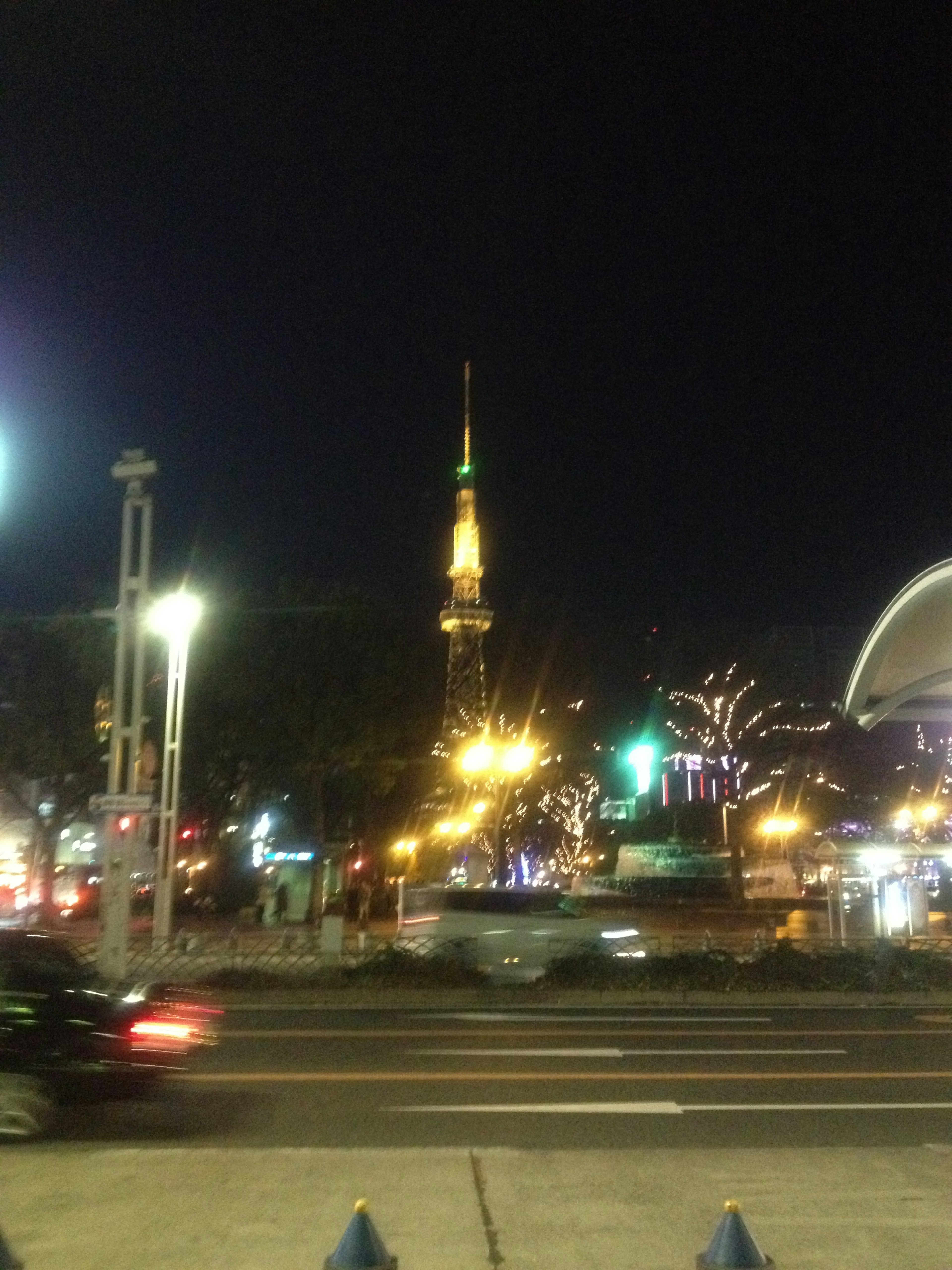 Tokyo Tower illuminated at night with surrounding city lights