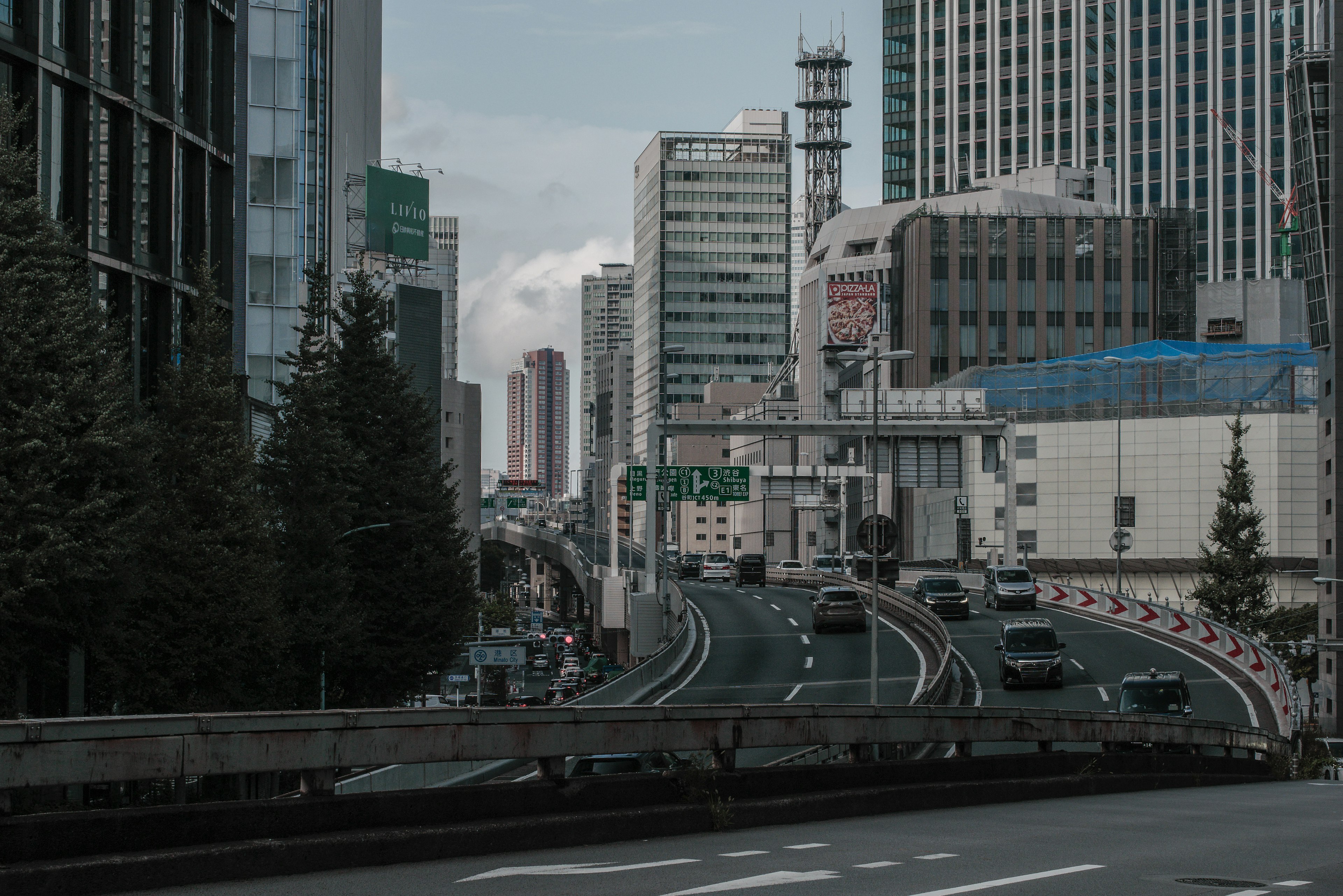 Urban highway scene with skyscrapers and modern buildings