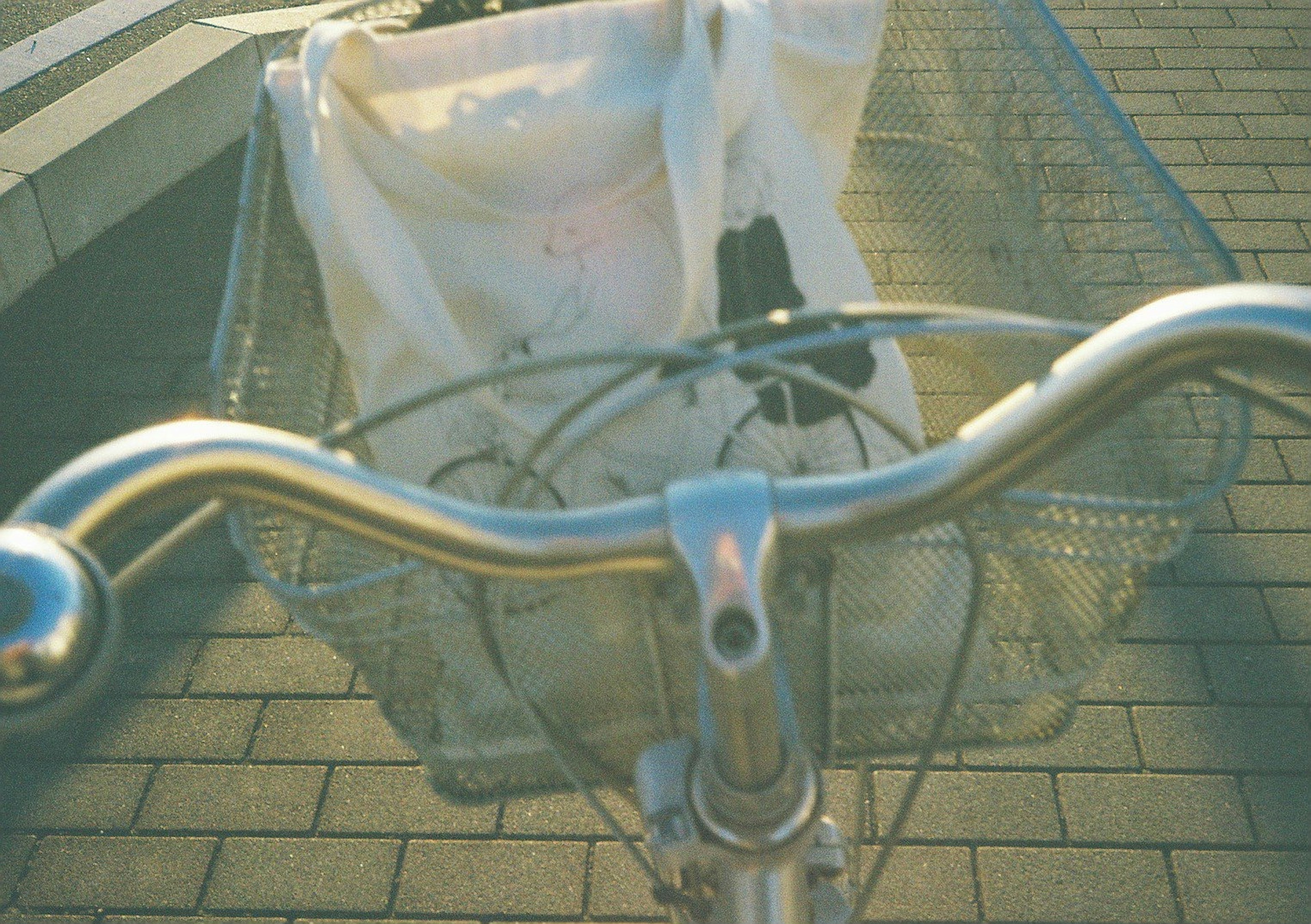 Close-up view of a bicycle handlebar and basket