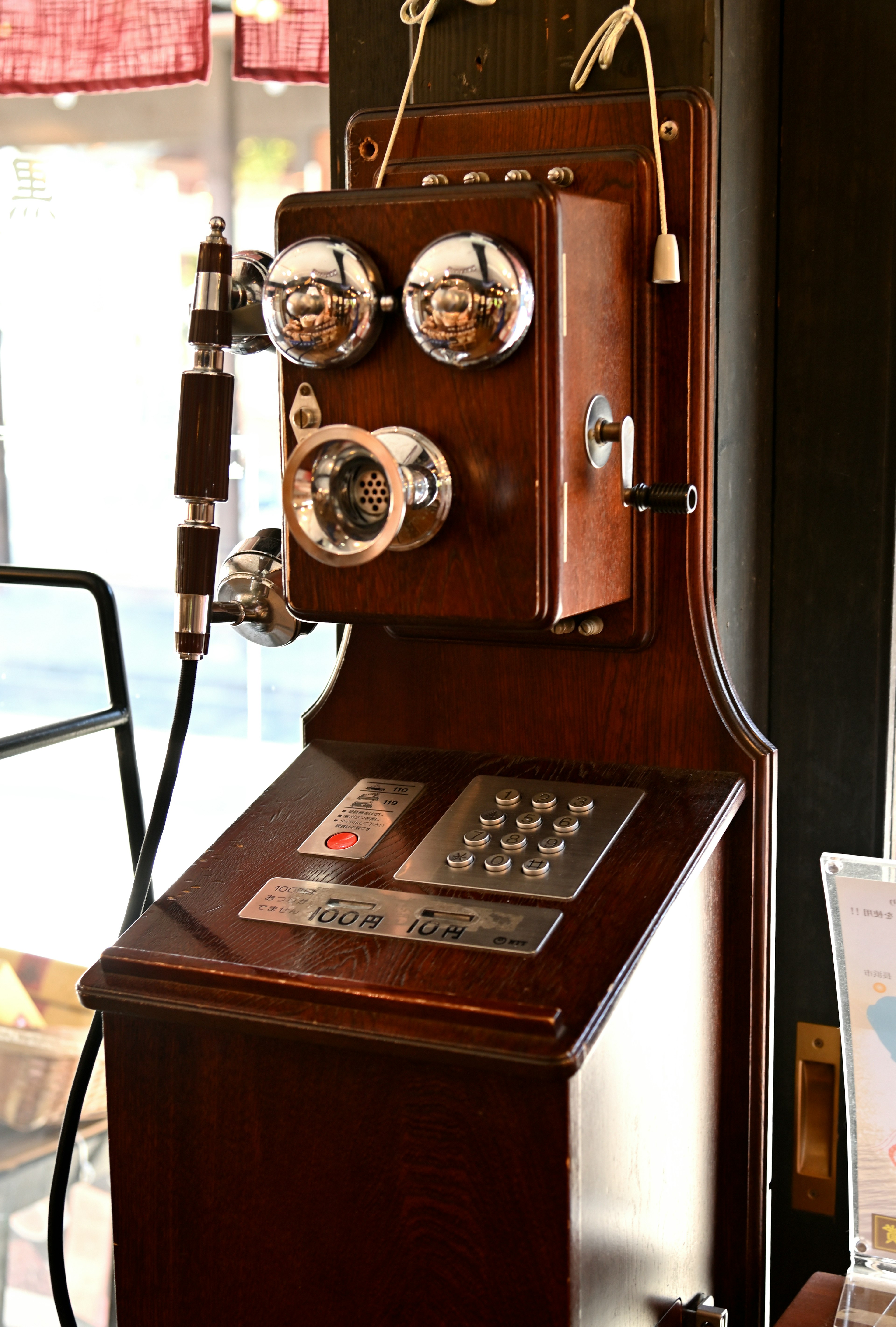 Vintage telephone with wooden base silver dials and speakers