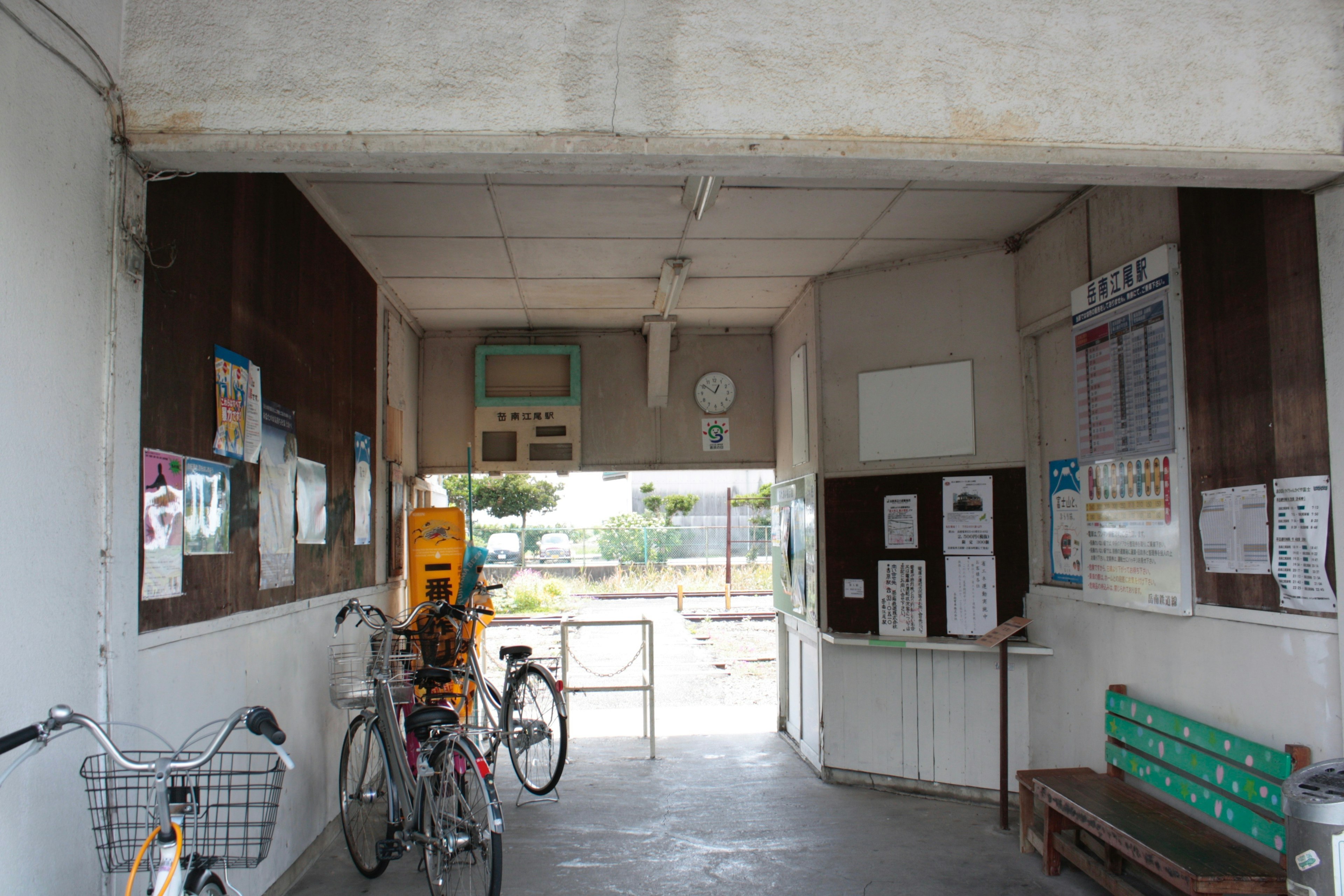 Interior view of an open corridor with parked bicycles