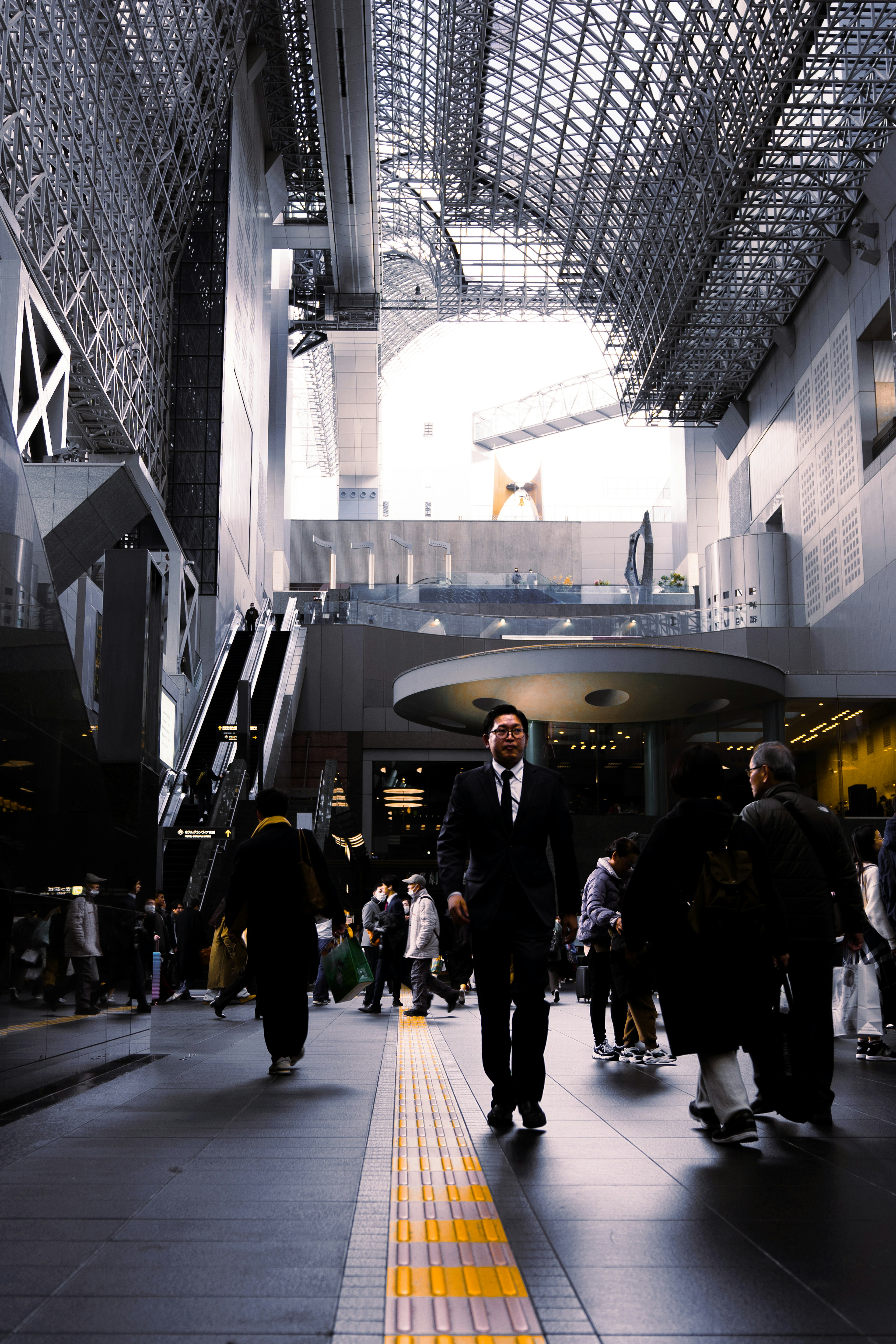 Interior of a modern station with people walking Bright lighting and beautiful ceiling design