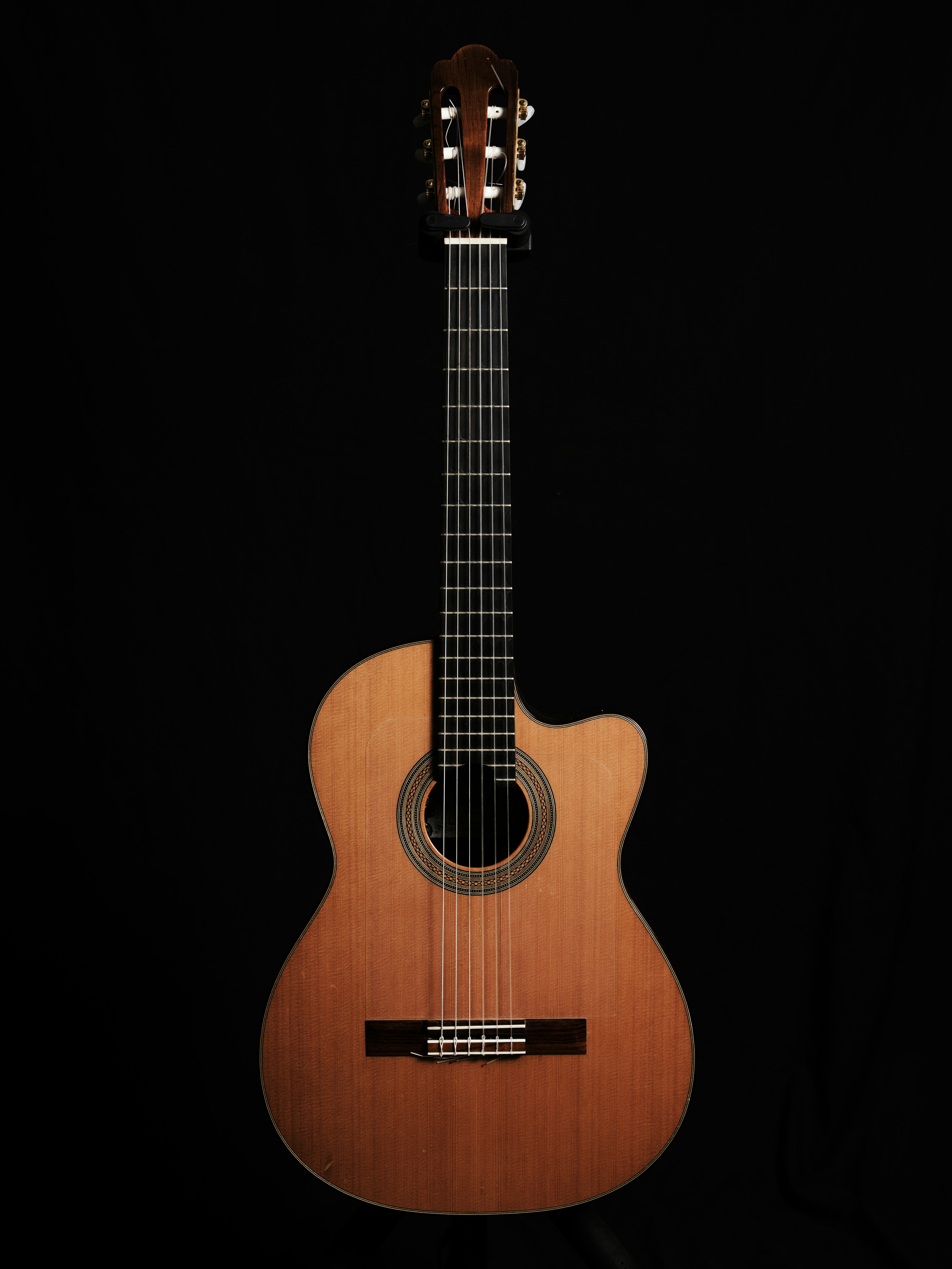 Acoustic guitar displayed against a black background