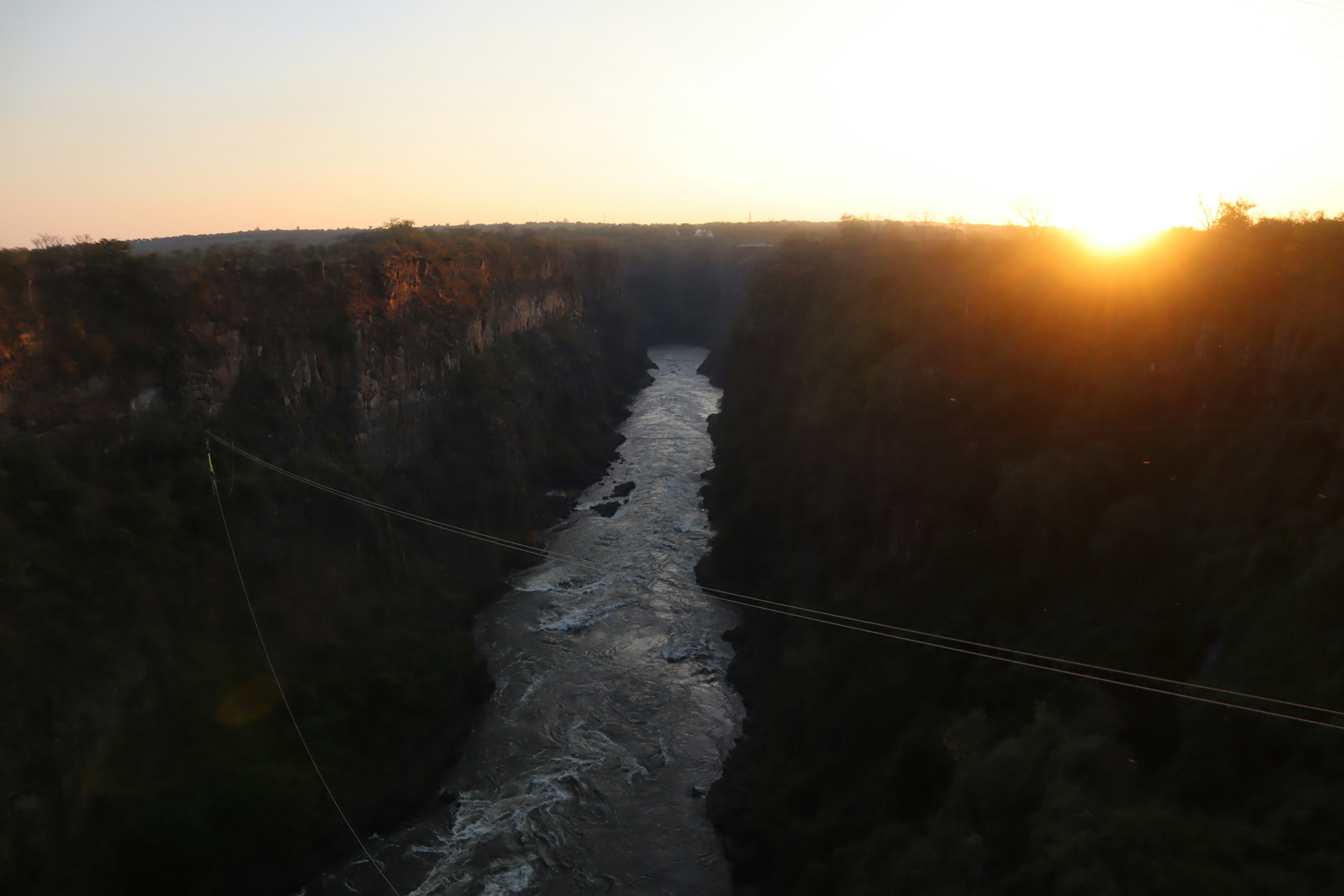 Canyon view with rushing river at sunset