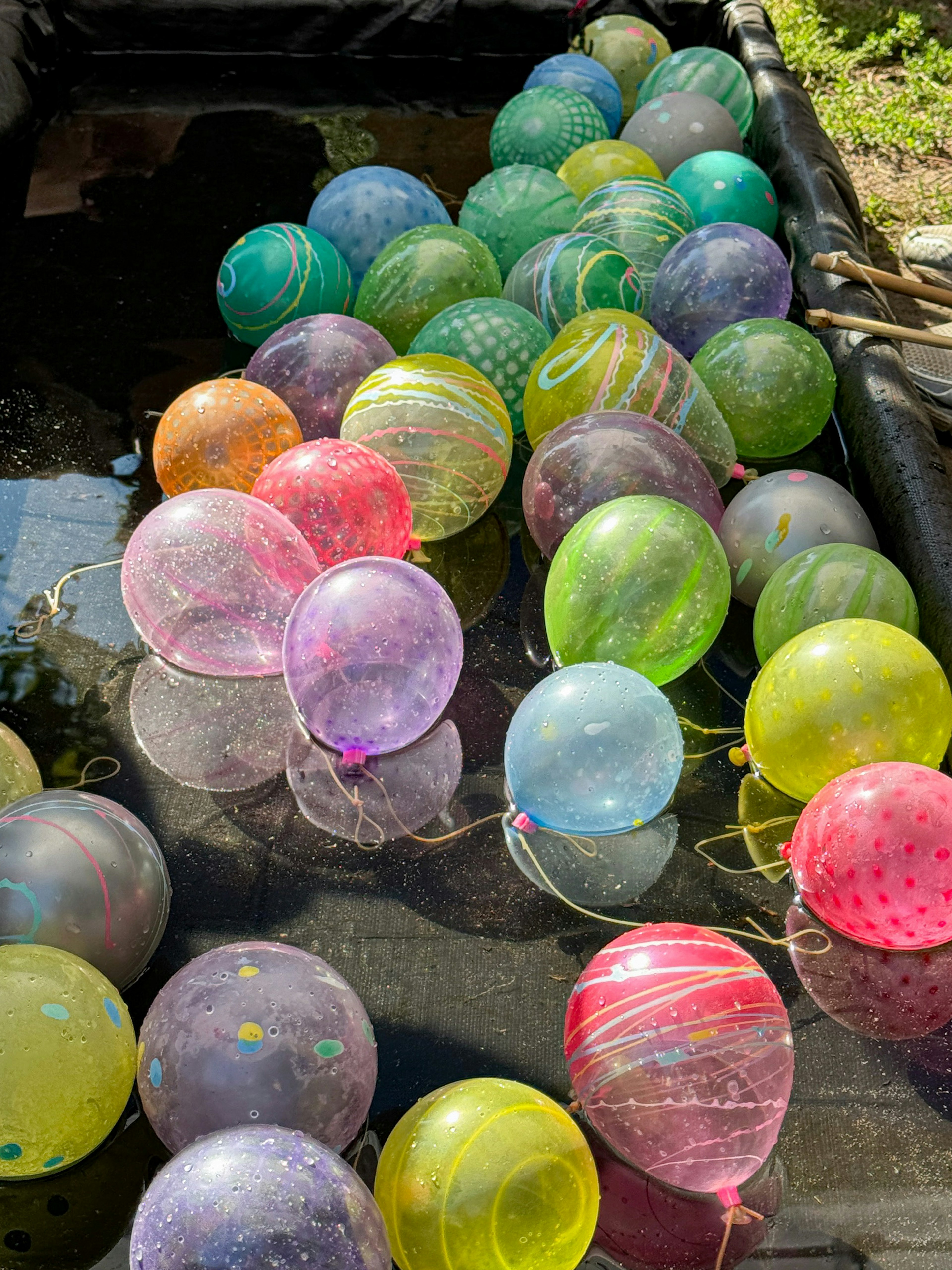 Colorful balloons floating on the water surface