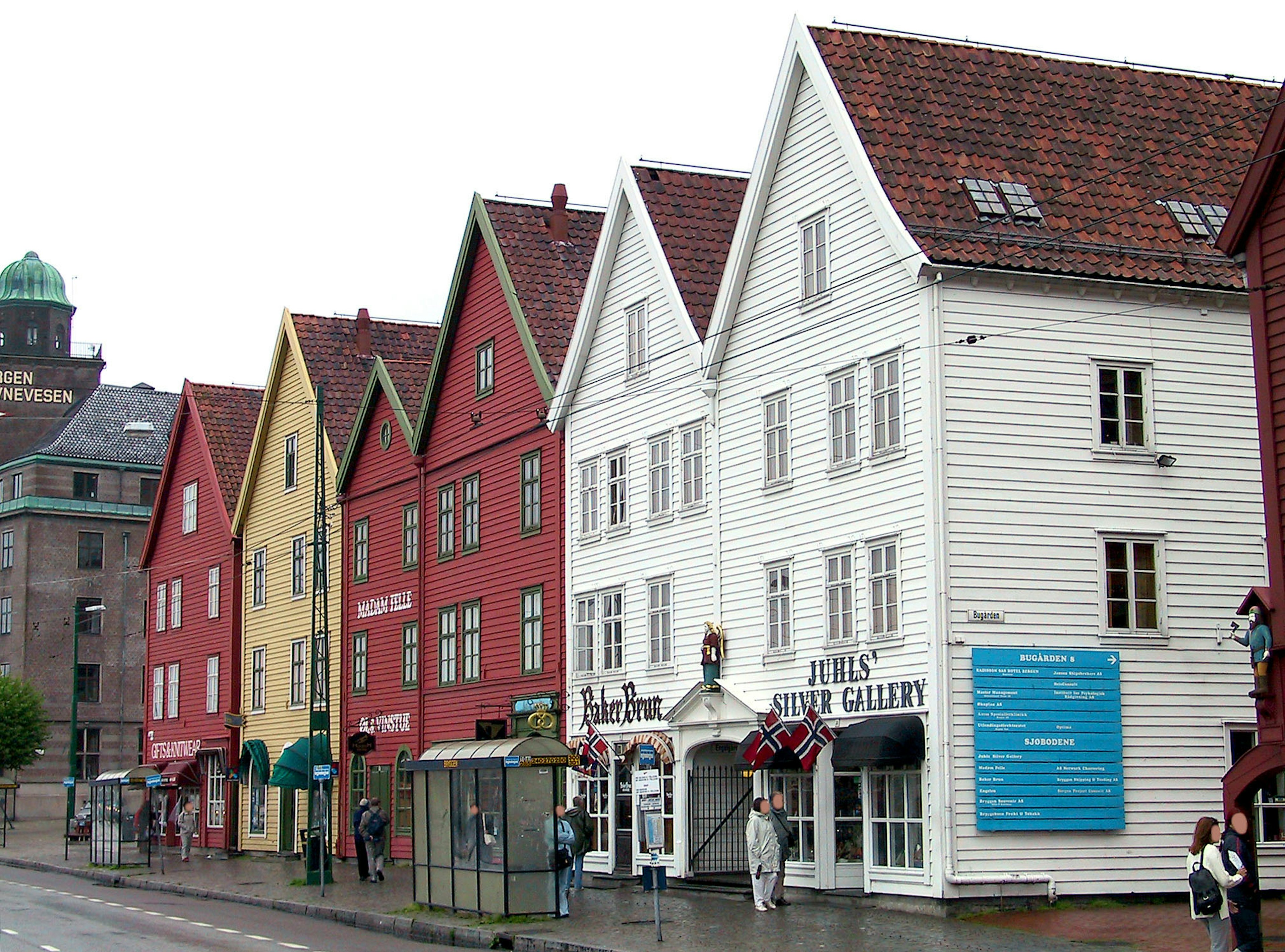 Colorful wooden houses lining a street in Bergen's Hanseatic Wharf area