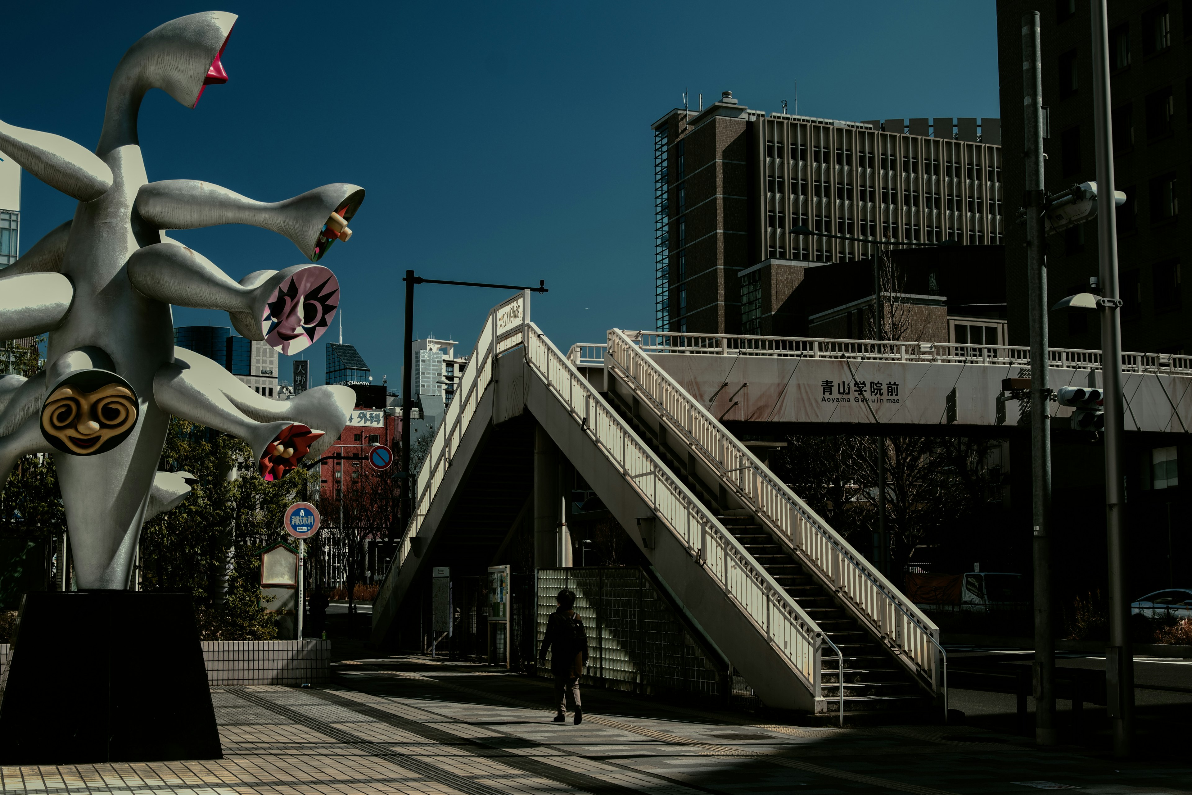 Urban landscape featuring a unique sculpture and staircase