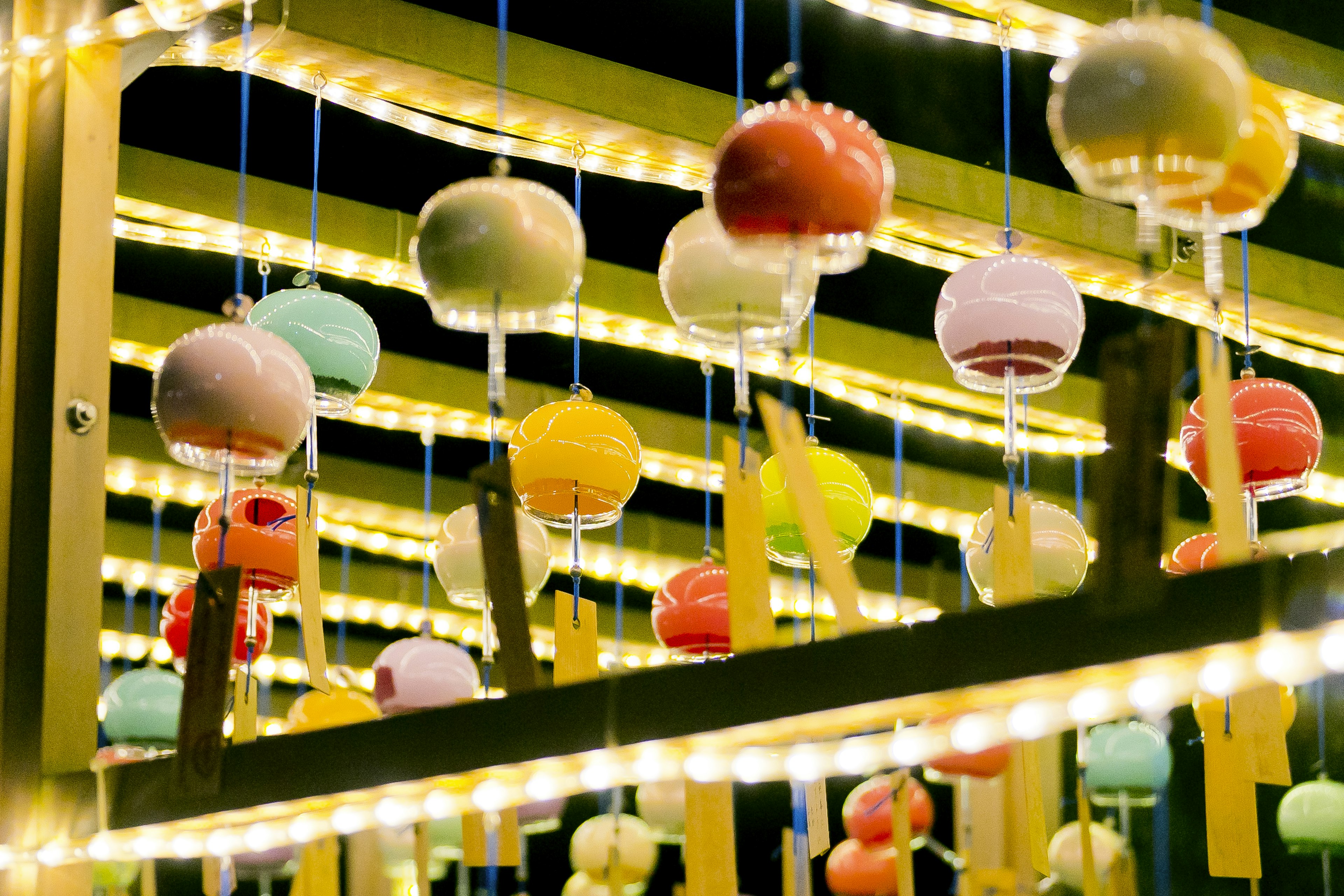 Colorful wind chimes hanging in a beautiful display