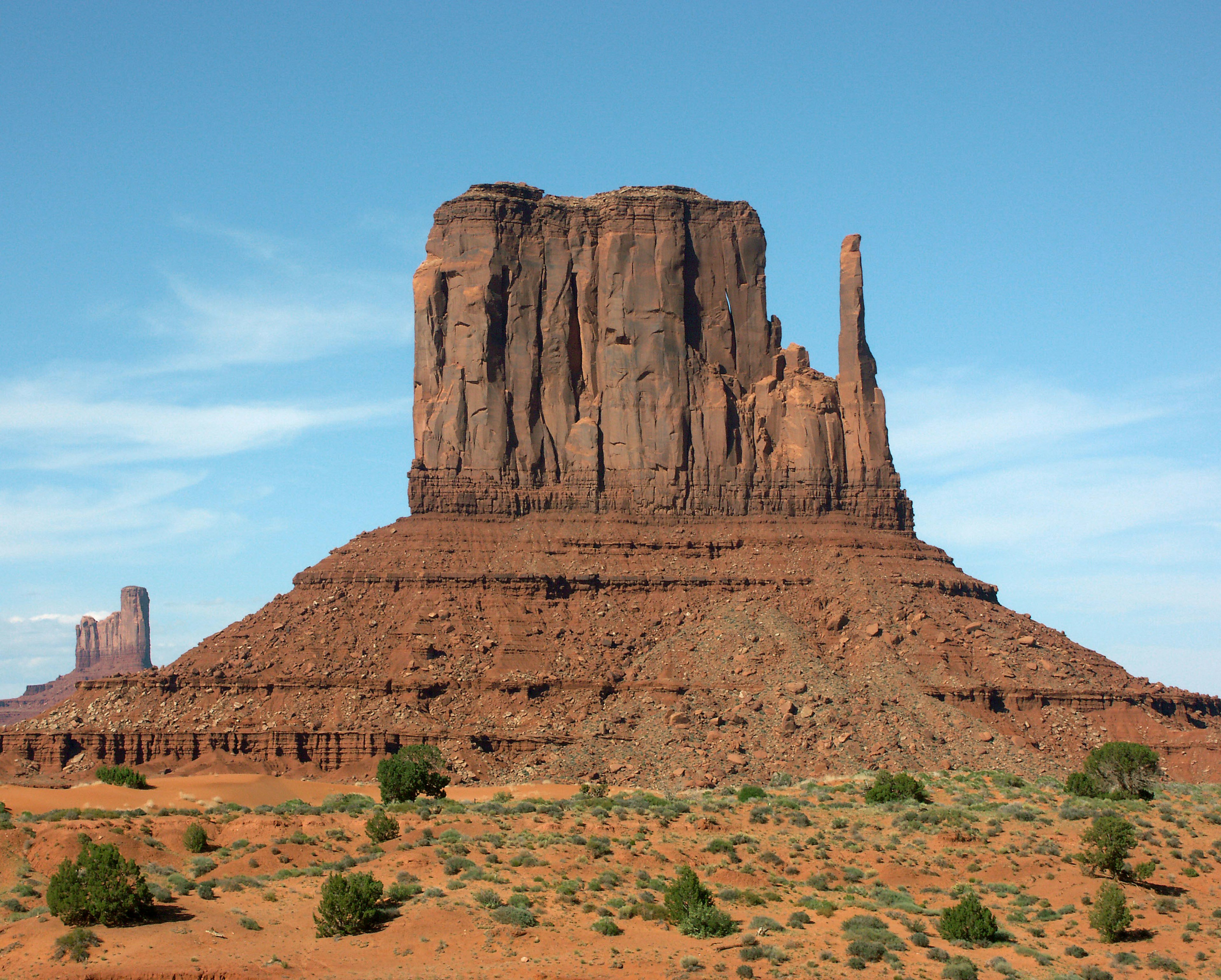 Monument Valley with iconic red rock formations and blue sky