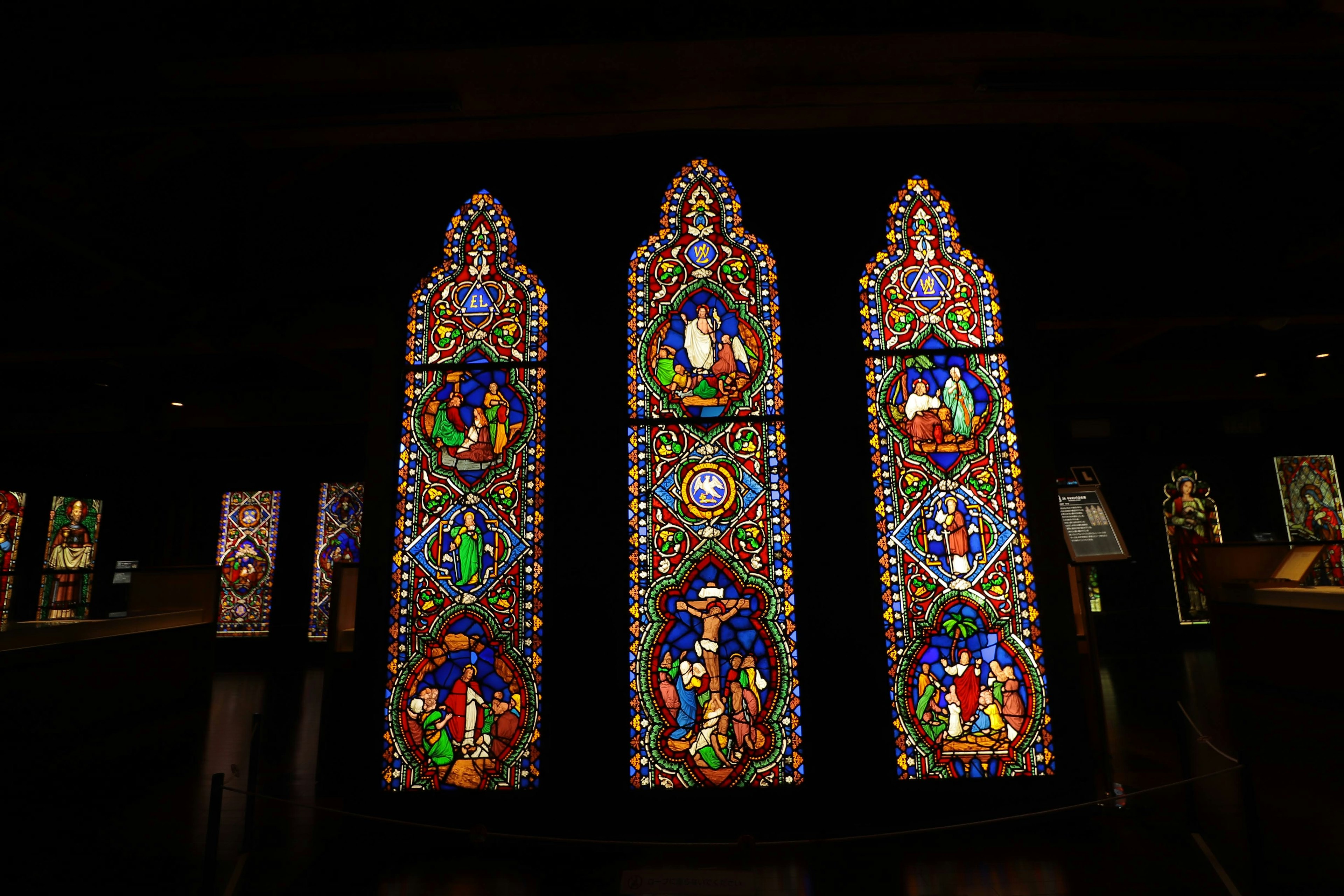 Interior view of a church featuring beautiful stained glass windows