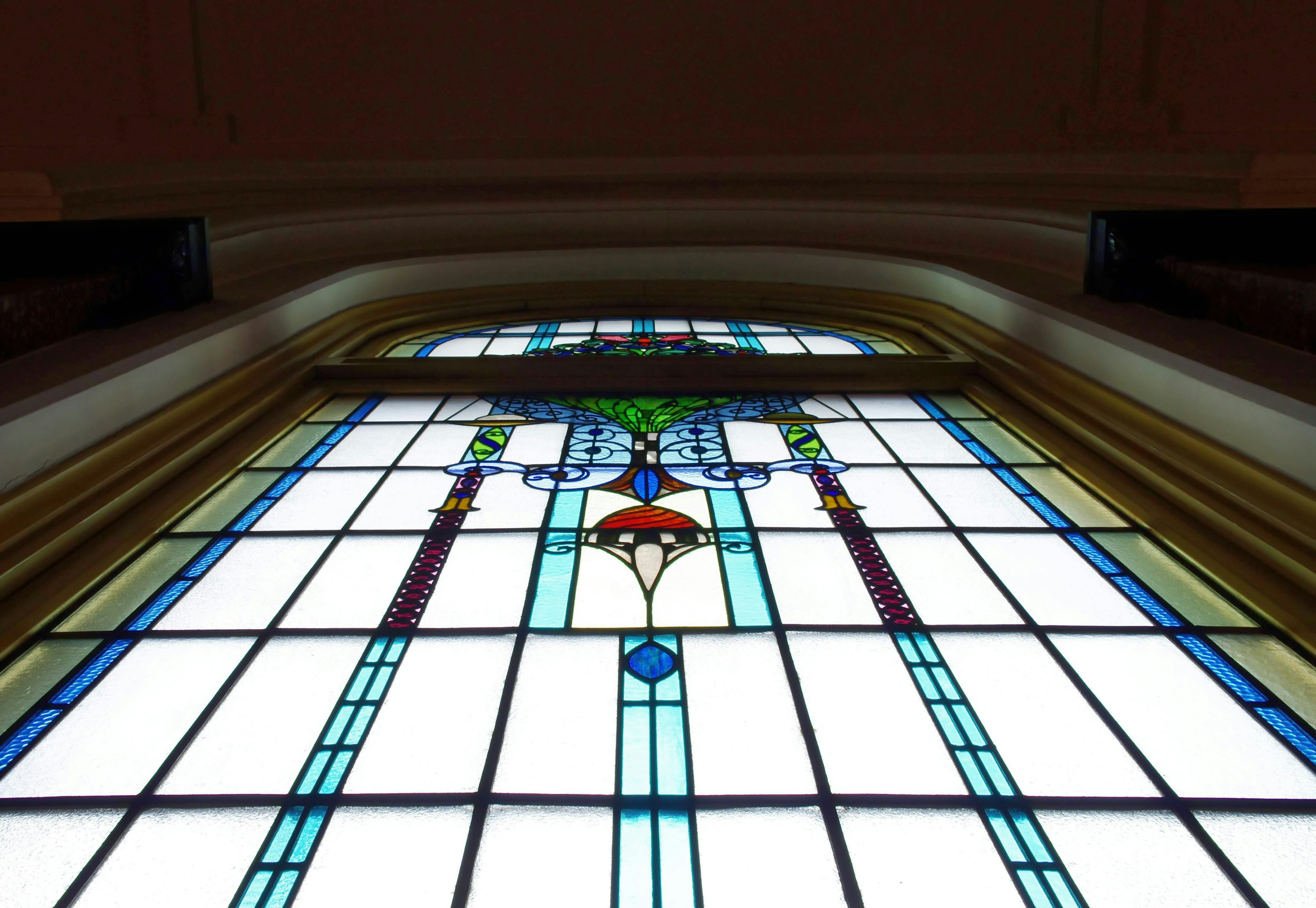 Beautiful stained glass window details visible from a low angle